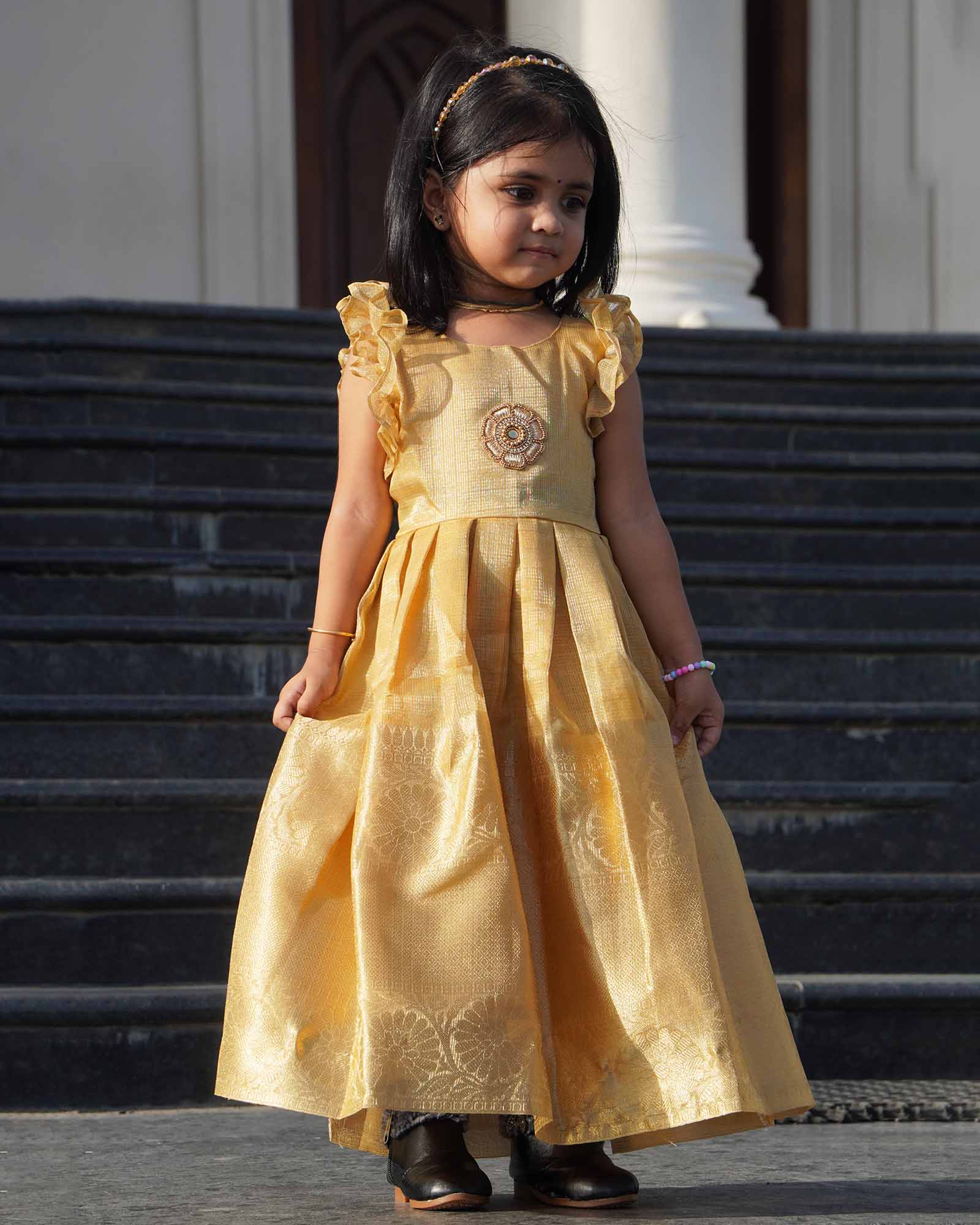 Gold Raw Silk Pattu Gown | Frill Sleeve Festival Wear Prince N Princess Gold Raw Silk Pattu Gown | Frill Sleeve Festival Wear Prince N Princess