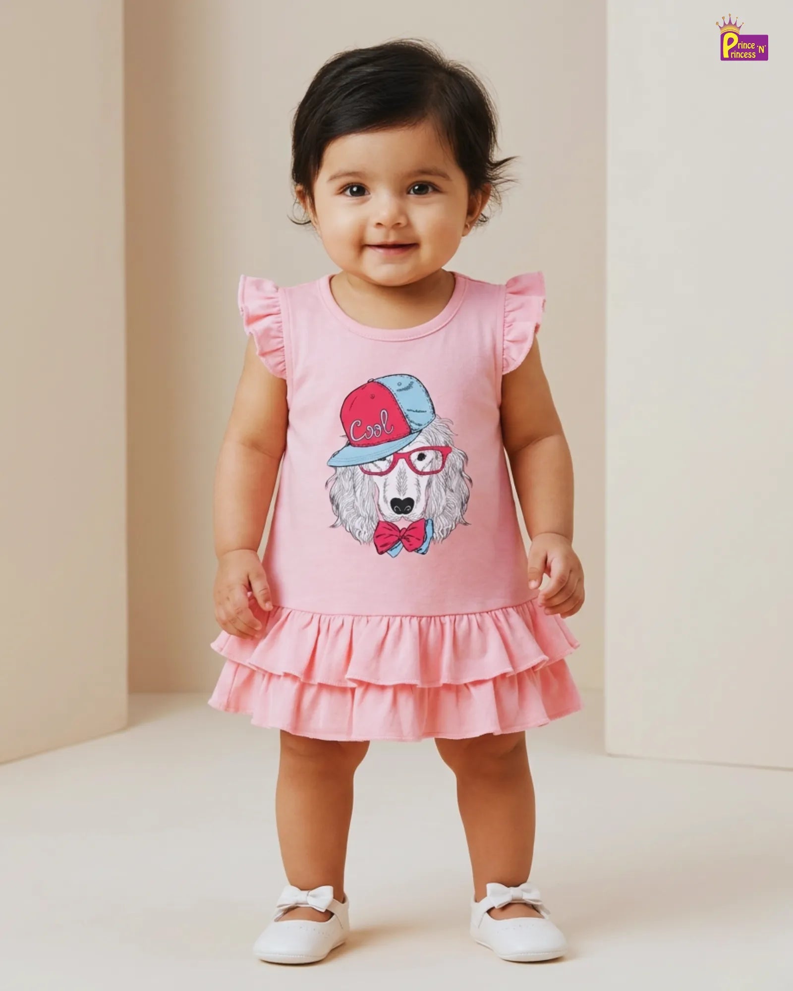 Child wearing a pink dress with a cartoon character on a plain background