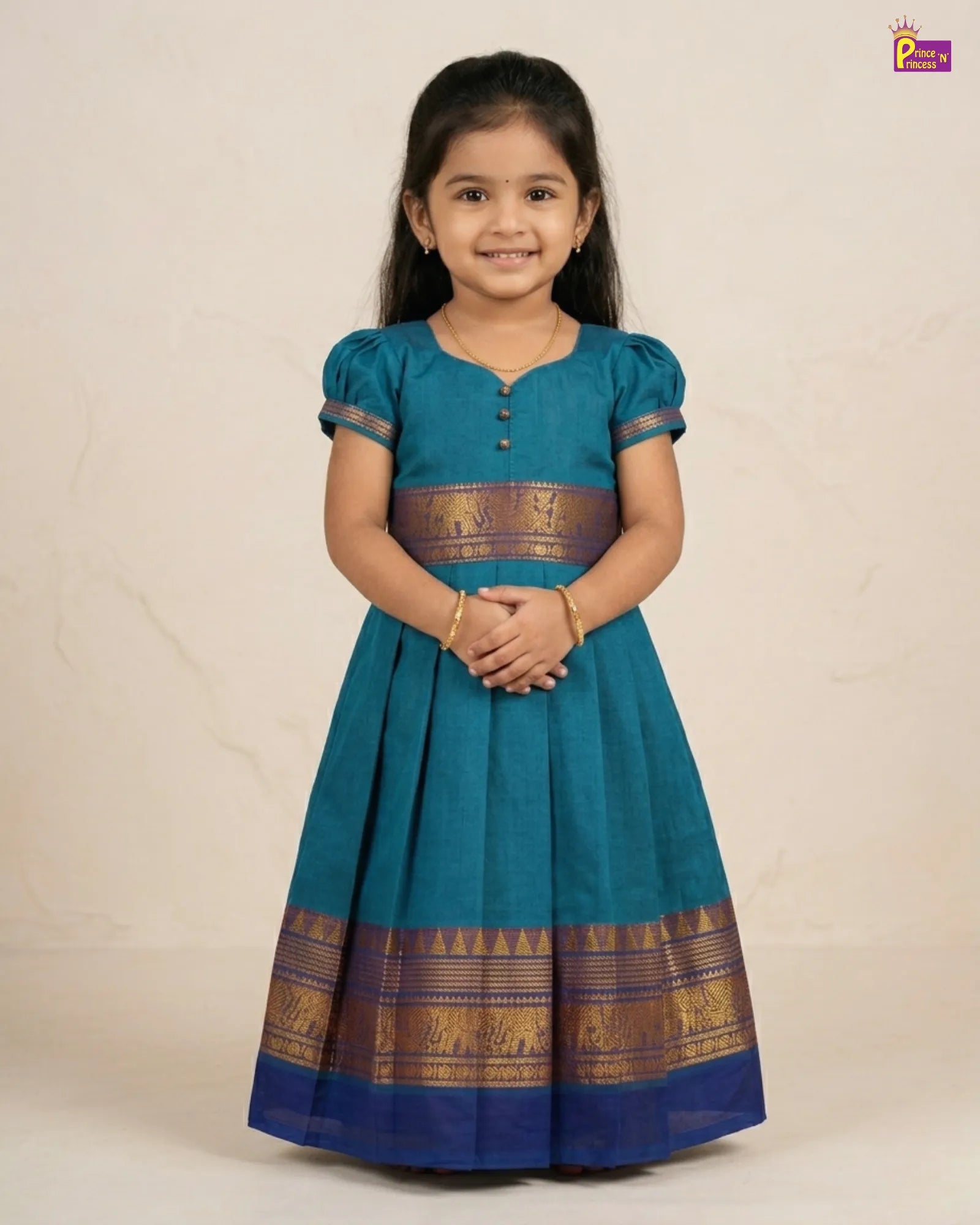 Young girl wearing a blue traditional dress with gold accents on a beige background