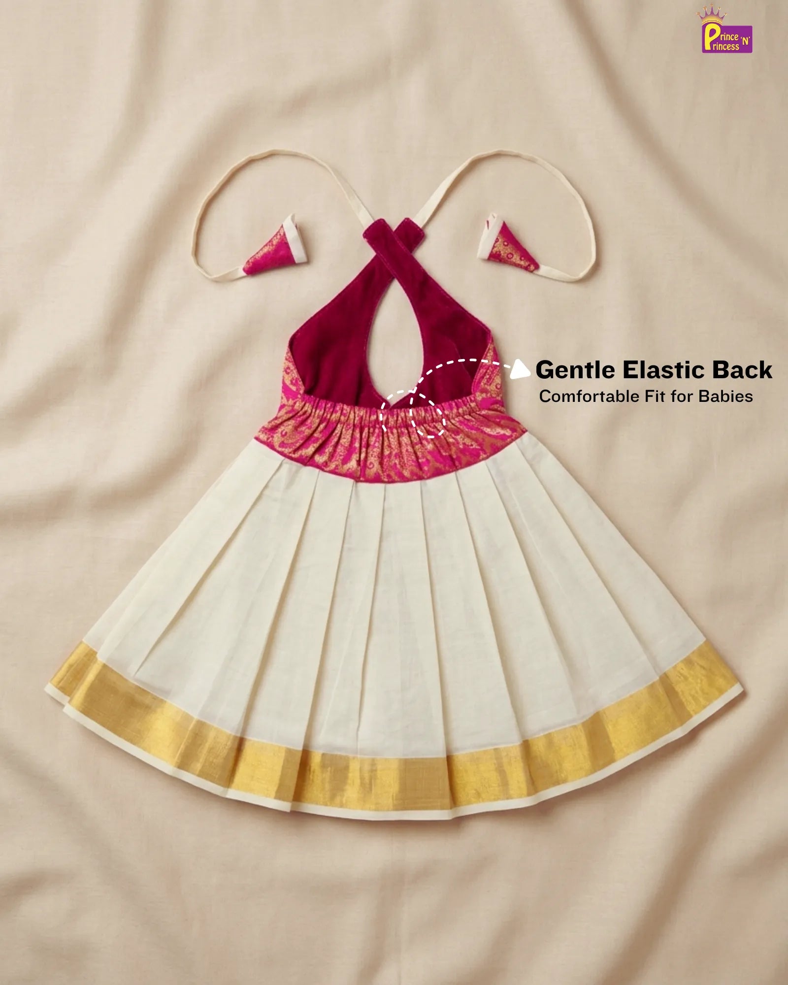 Baby dress with pink top and white skirt on a beige background