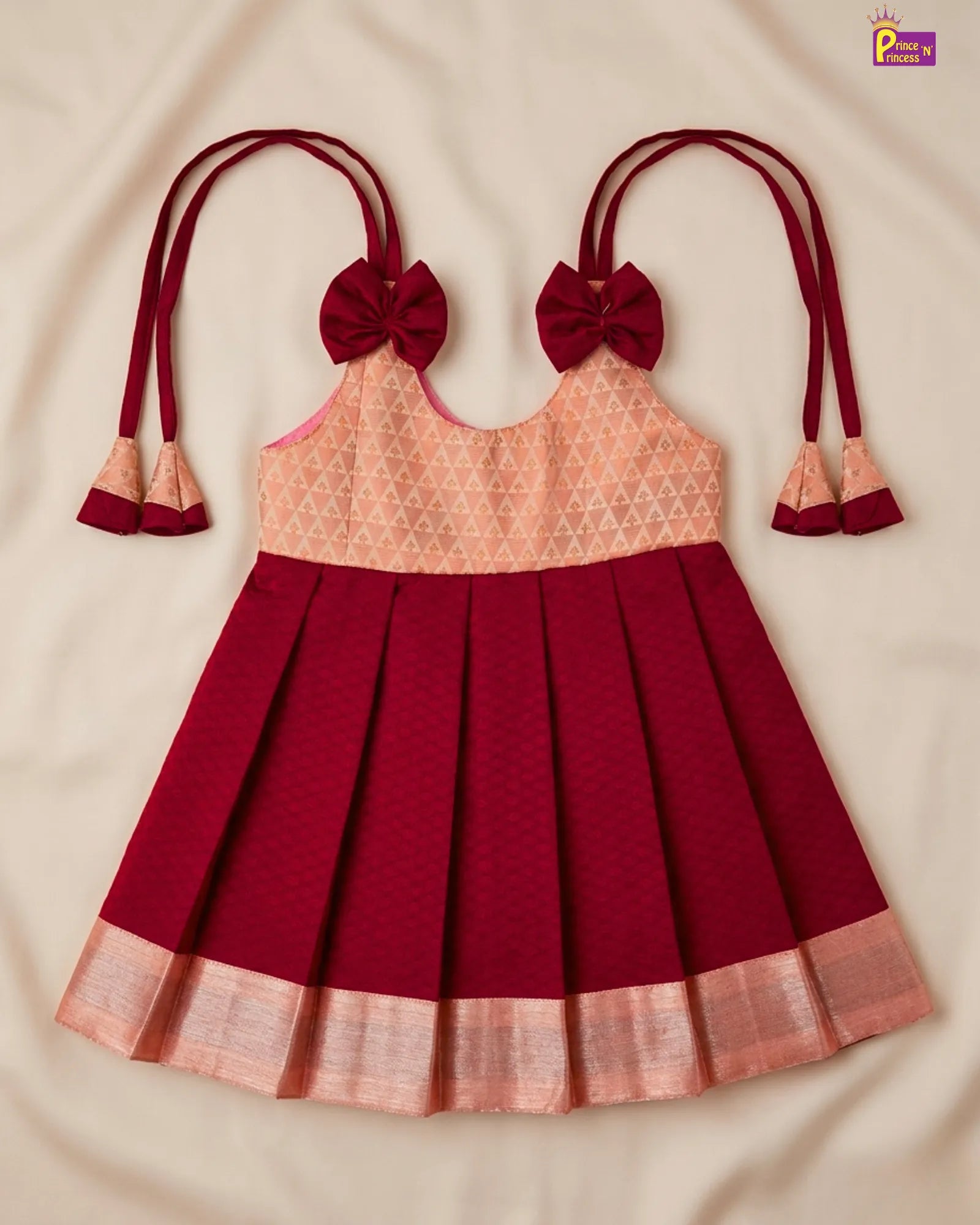 Red and peach traditional dress with decorative elements on a beige background