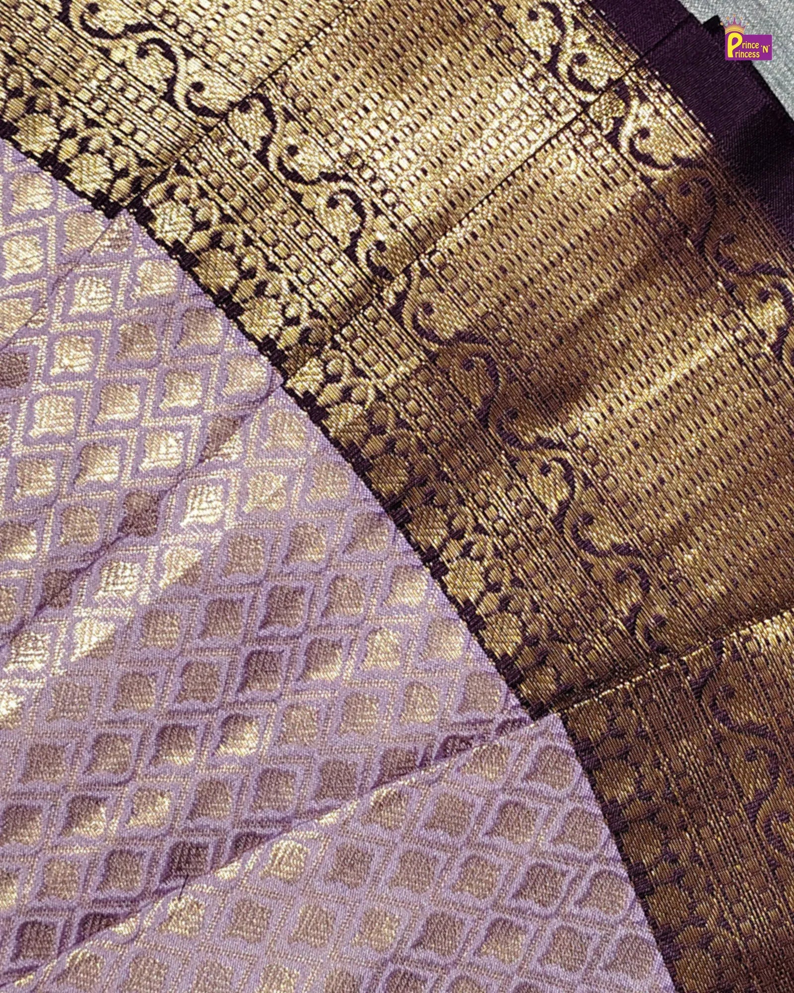 Close-up of a fabric with gold and purple patterns Banarasi Pattu 