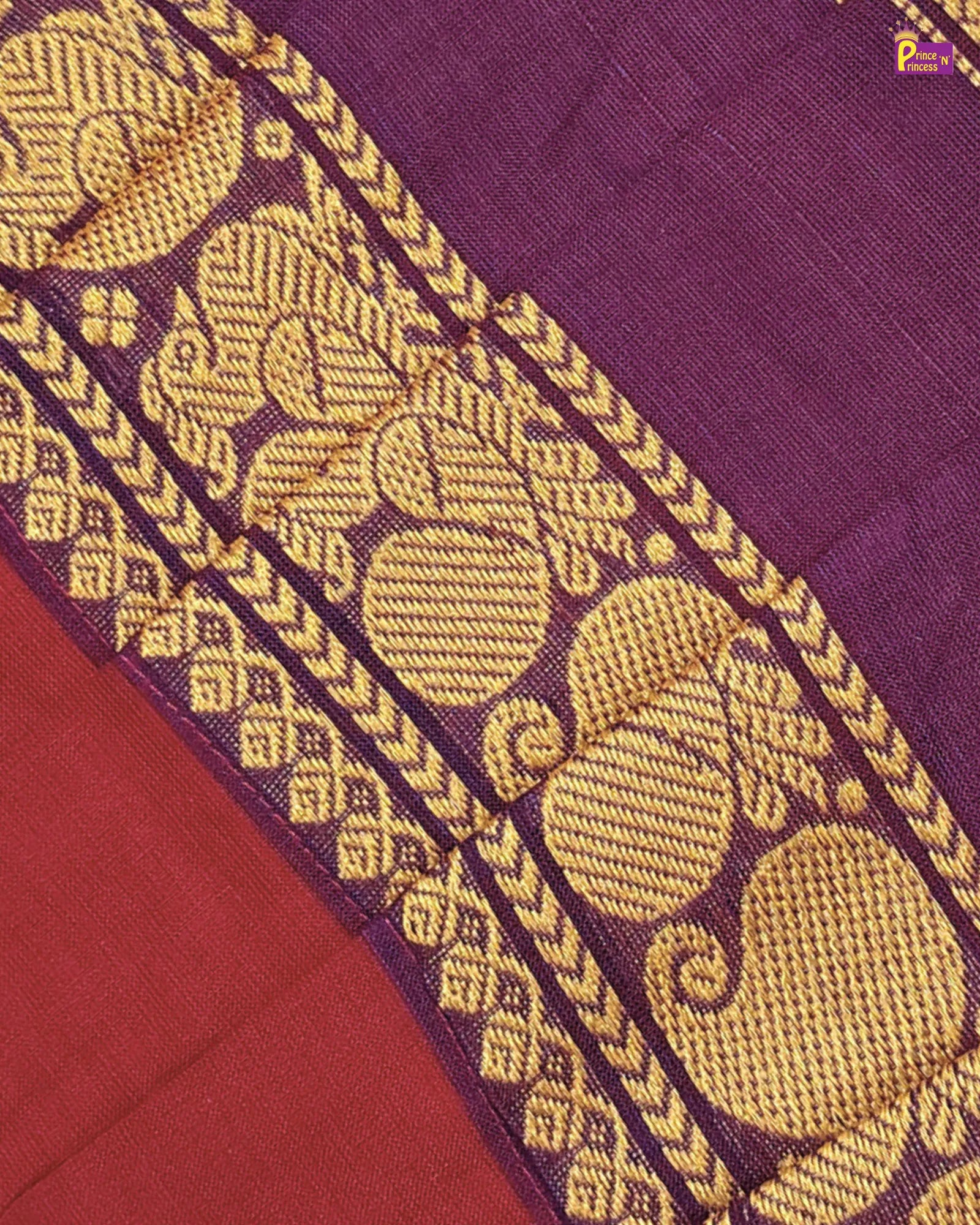 Close-up of a purple fabric with gold embroidery