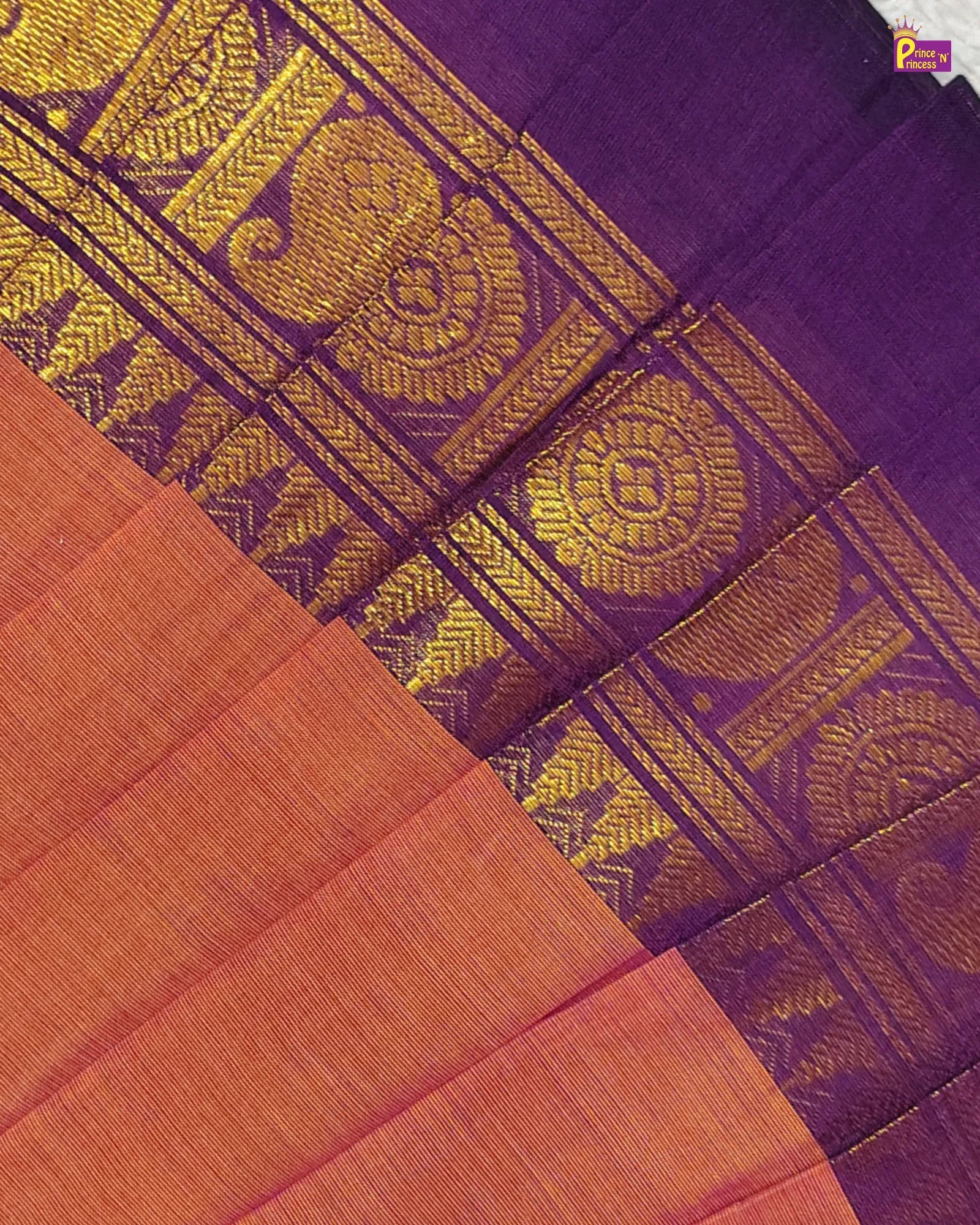 Purple and orange fabric with intricate gold patterns