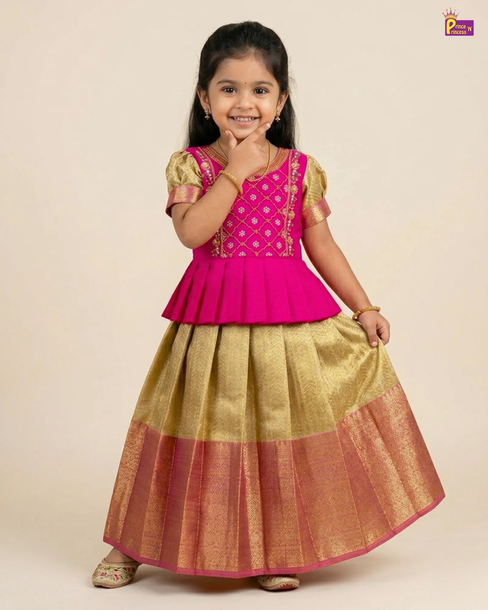 Young girl wearing a pink top and gold skirt on a beige background