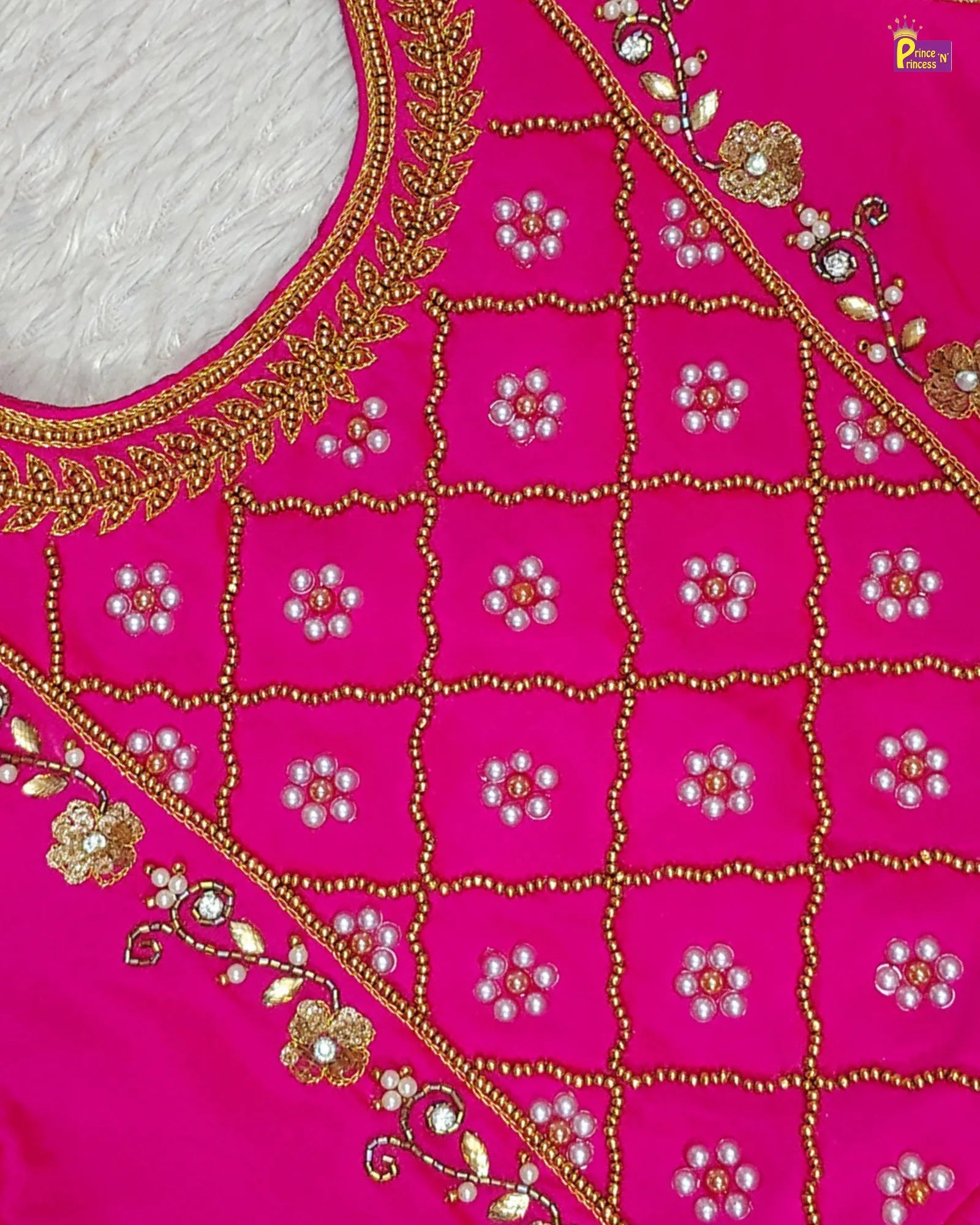 Pink fabric with gold and white embroidery