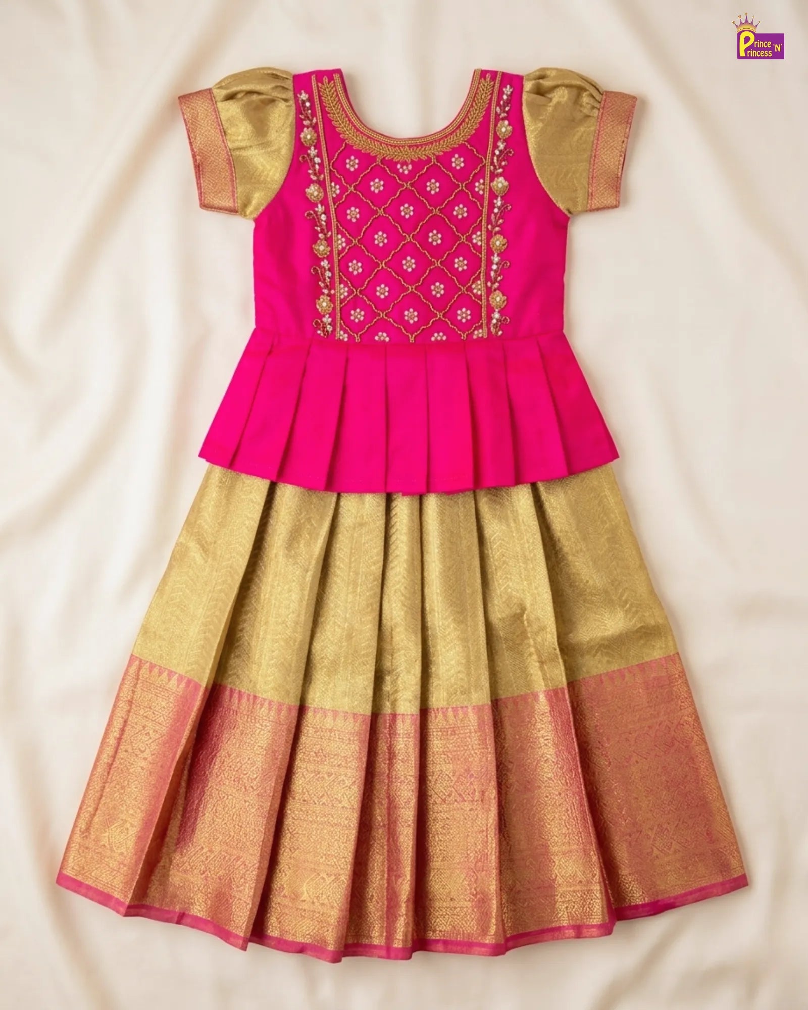 Pink and gold traditional outfit on a beige background