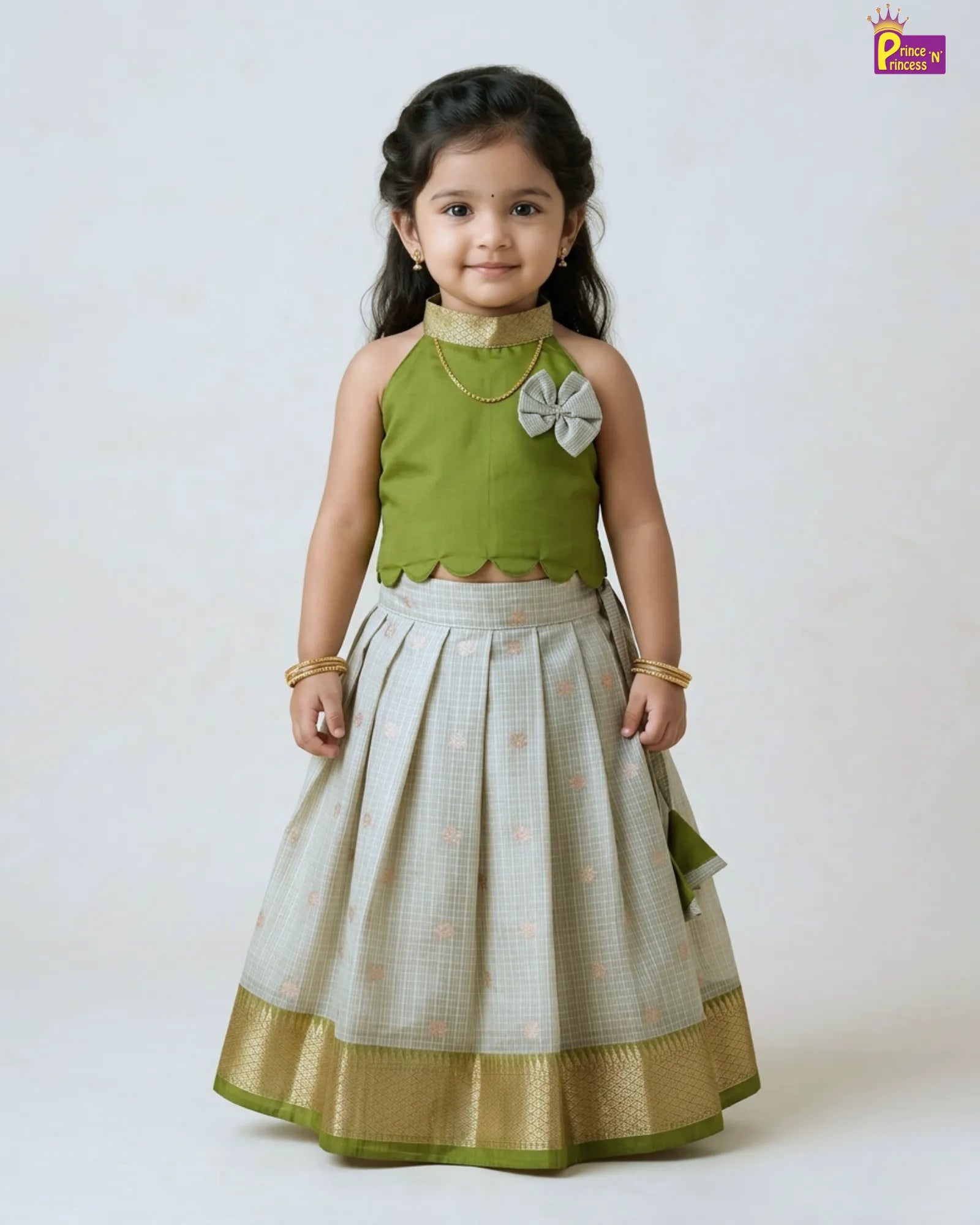 Girl wearing olive green raw silk pattu pavadai traditional kids ethnic dress