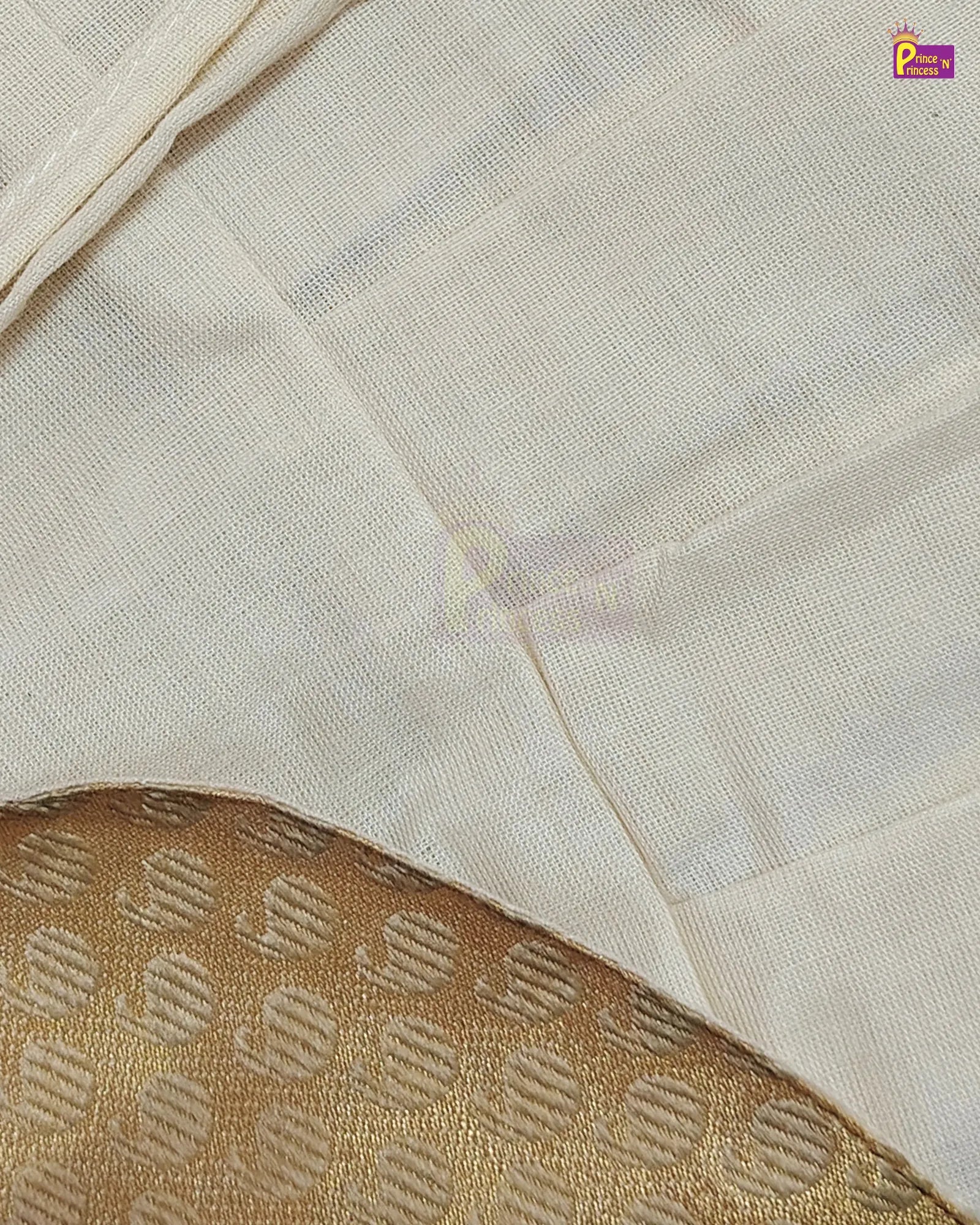 Close-up of a light cream or off-white fabric with a subtle woven texture, layered over a gold patterned textile. A small purple 'P' logo watermark is visible in the top right corner.