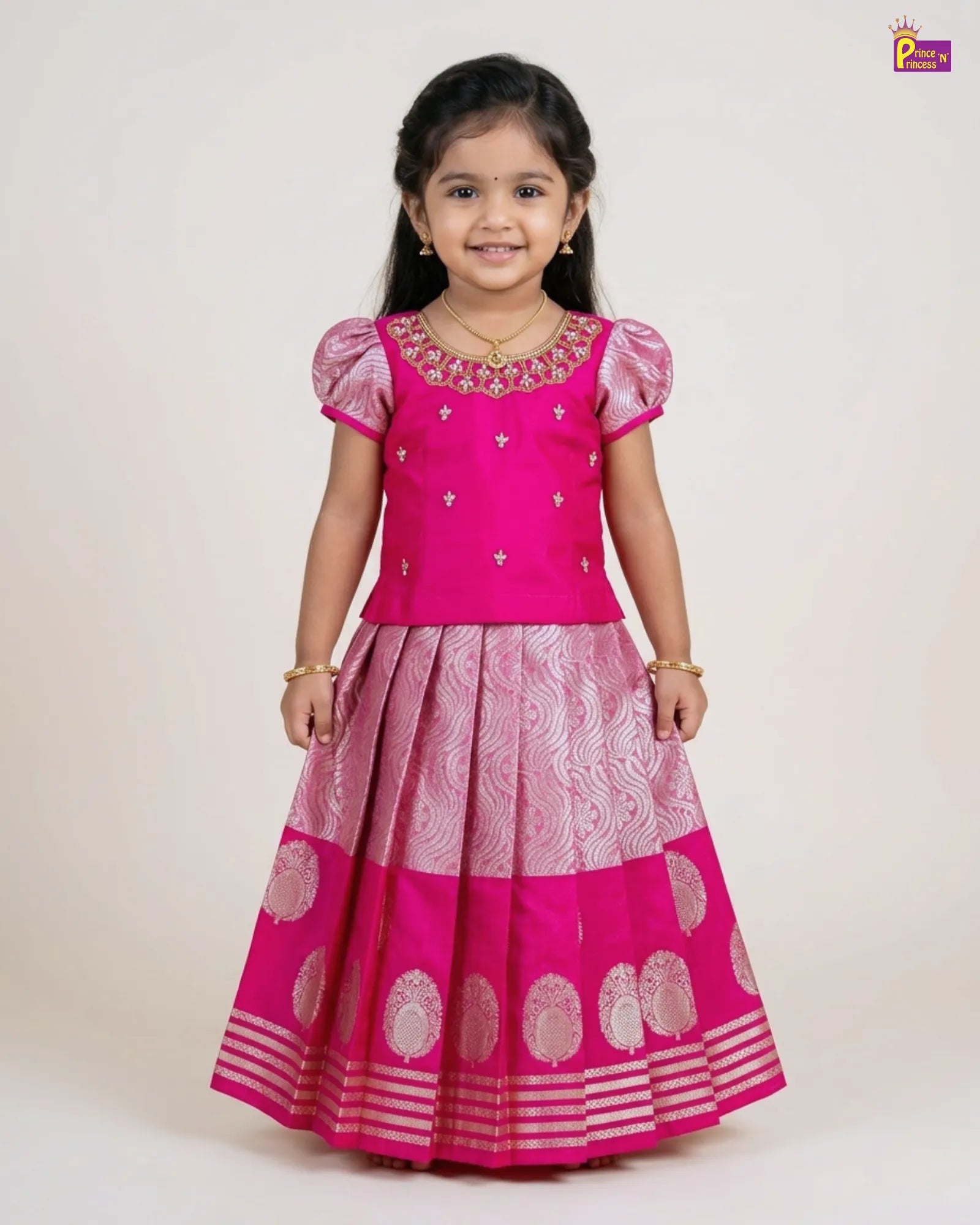 Young girl wearing a pink traditional outfit with a white background