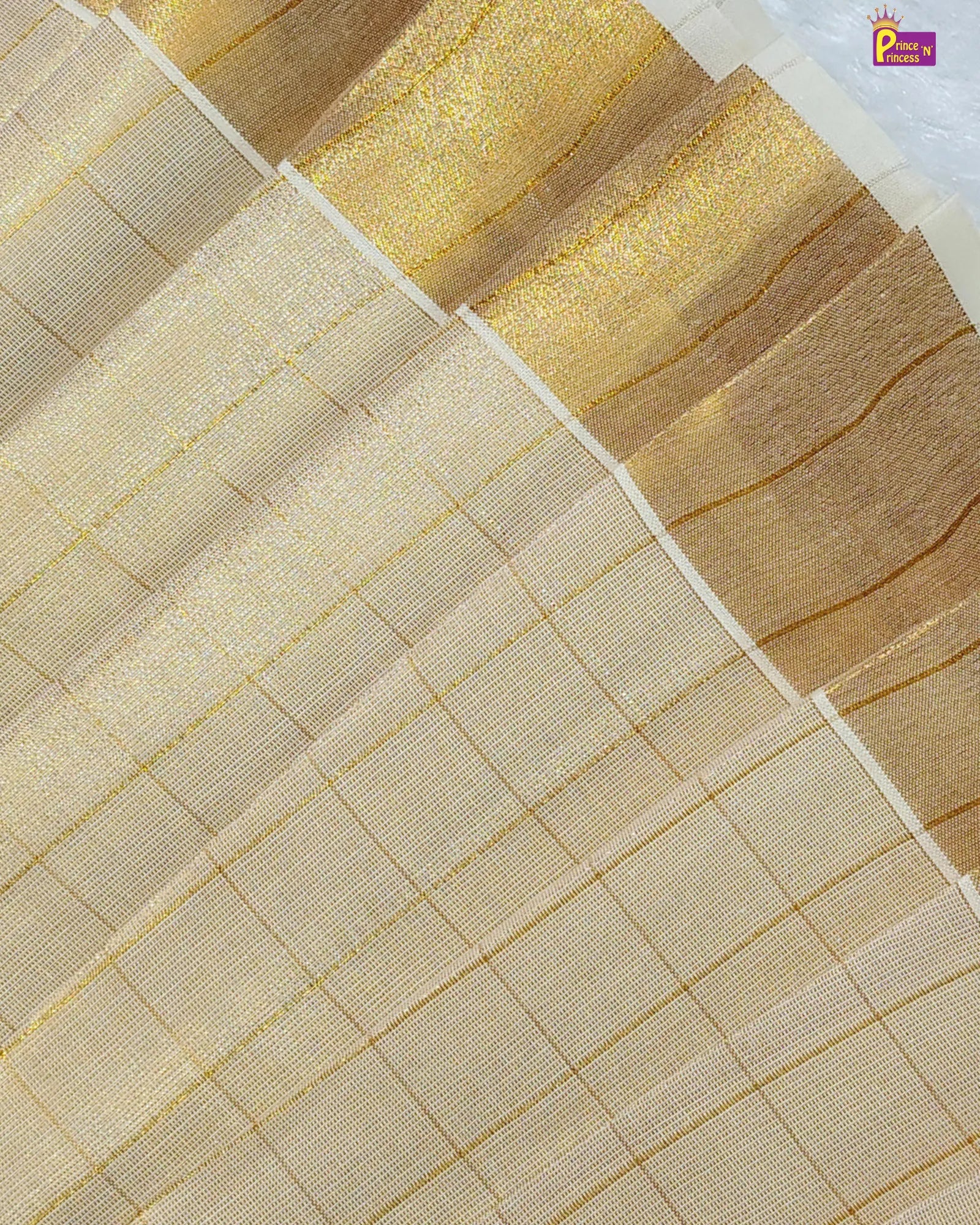Close-up of a fabric with gold and beige patterns