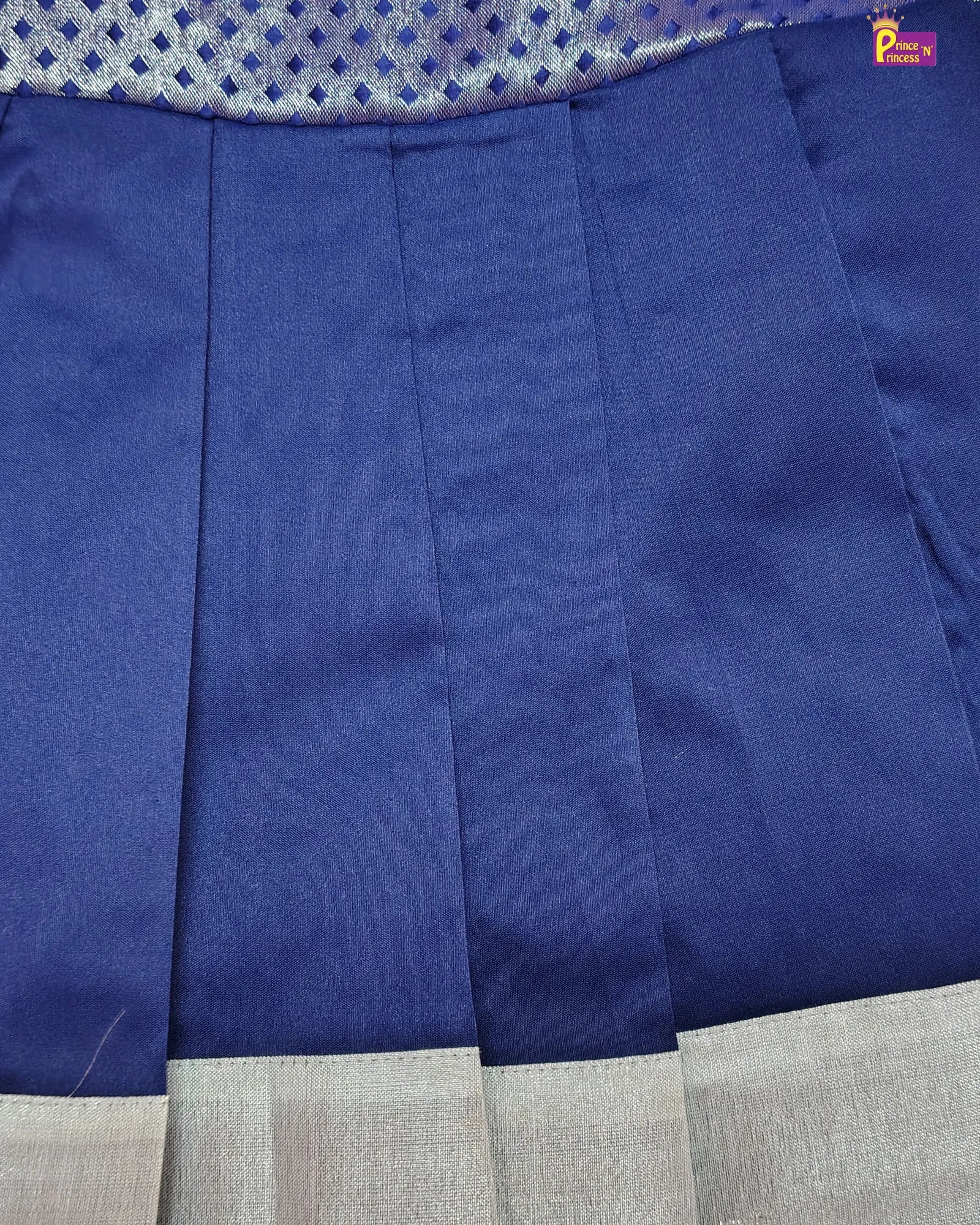 Close-up of blue fabric with a checkered pattern in the background