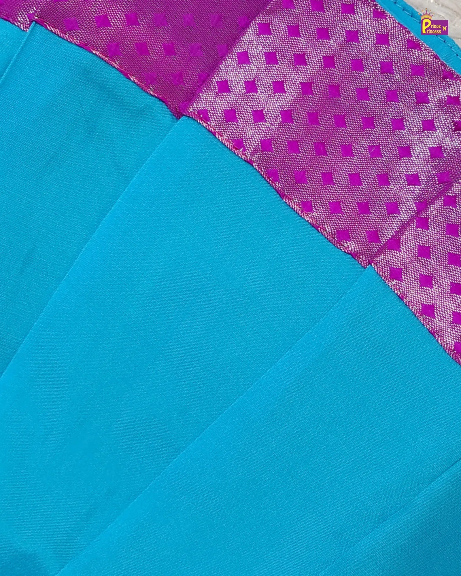 Blue fabric with purple geometric pattern
