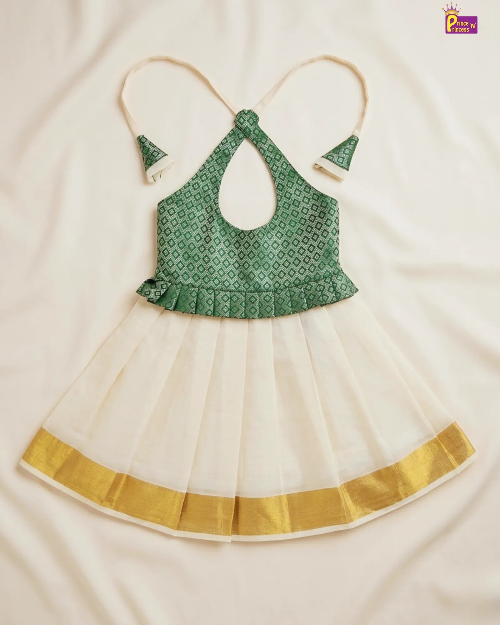 Green and white traditional outfit with gold trim on a beige background