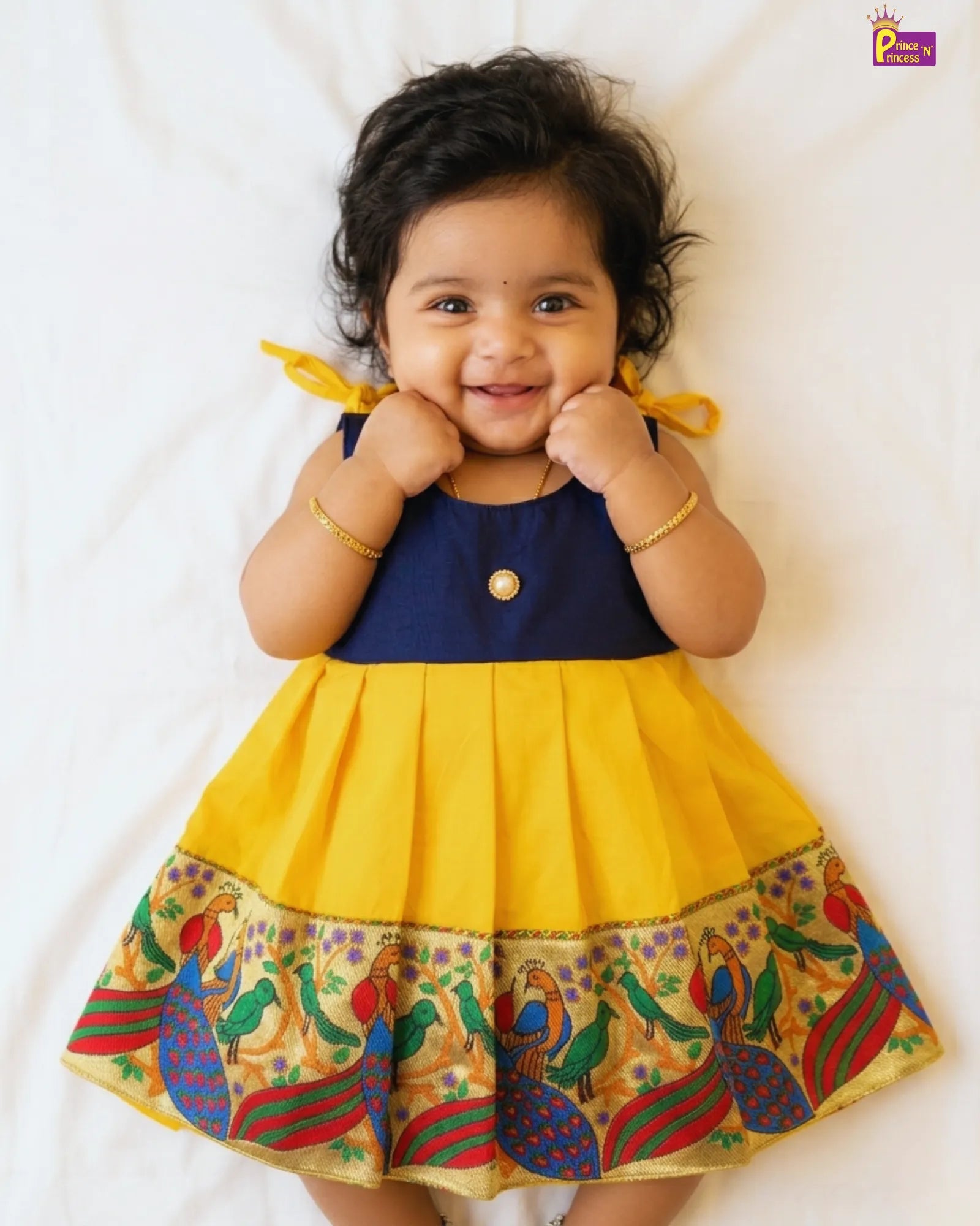 soft fabric baby feels comfort while wear our pattu frock so she give cute pose to photo