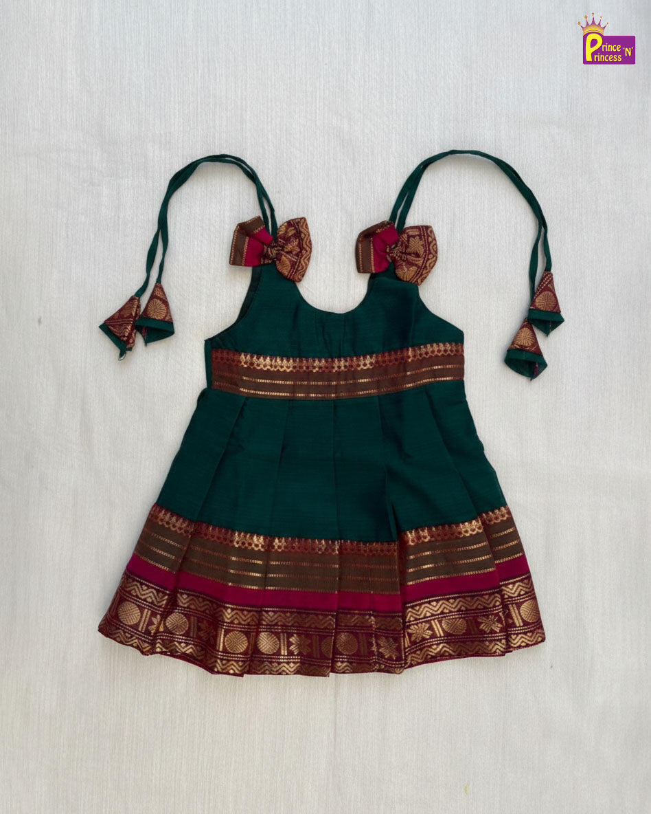 Green and brown traditional outfit with decorative elements on a light background - Prince N Princess