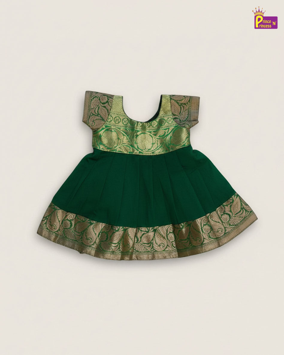 Green and gold traditional dress on a light gray background - Prince N Princess