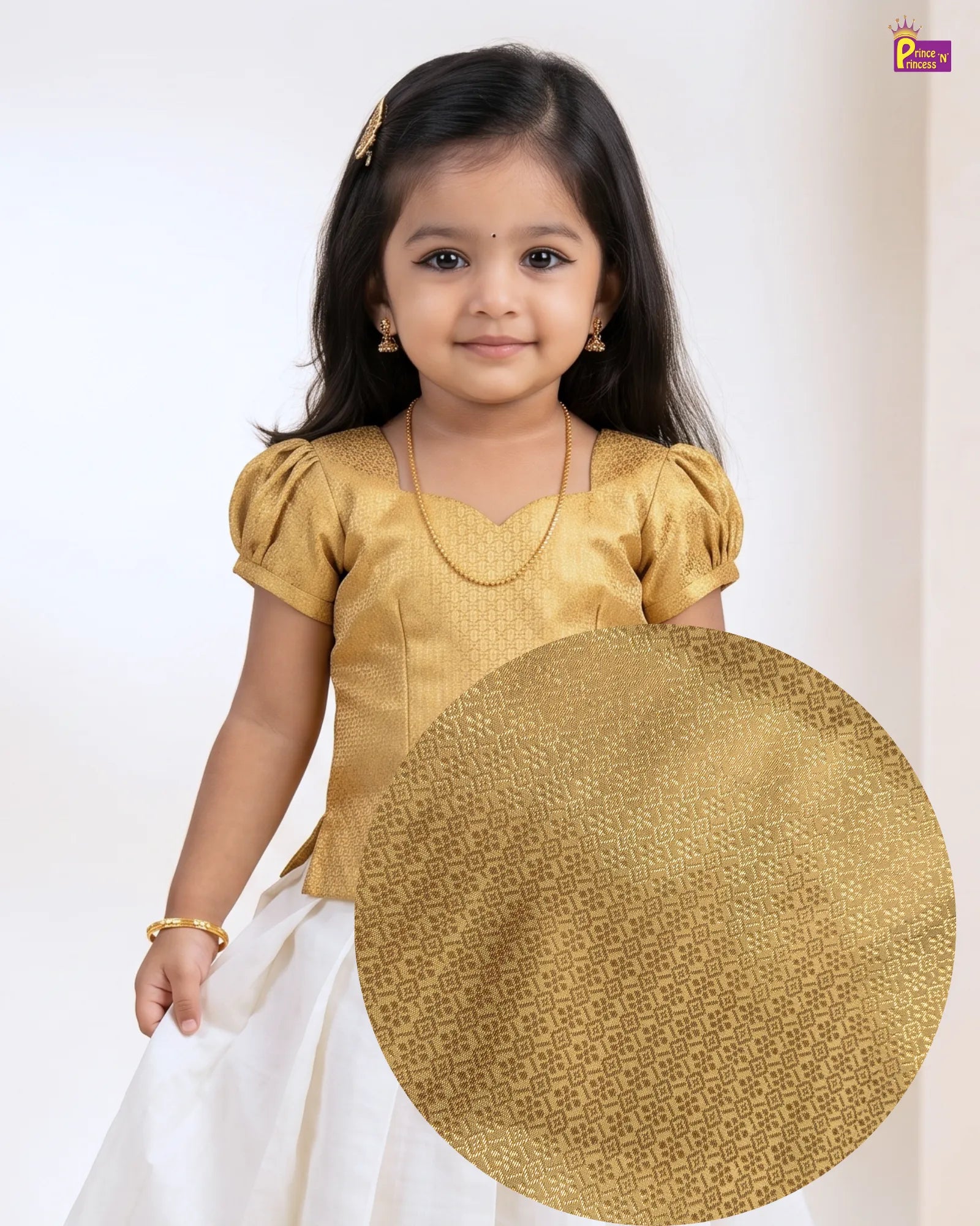A young girl wearing a gold traditional blouse with puff sleeves and a white skirt, shown against a plain light background. A large circular inset highlights the gold fabric pattern on the blouse.