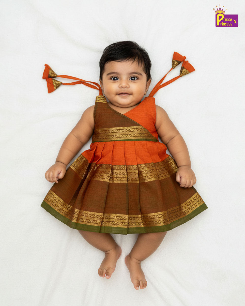 Baby wearing a traditional outfit with orange and brown colors on a white background - Prince N Princess