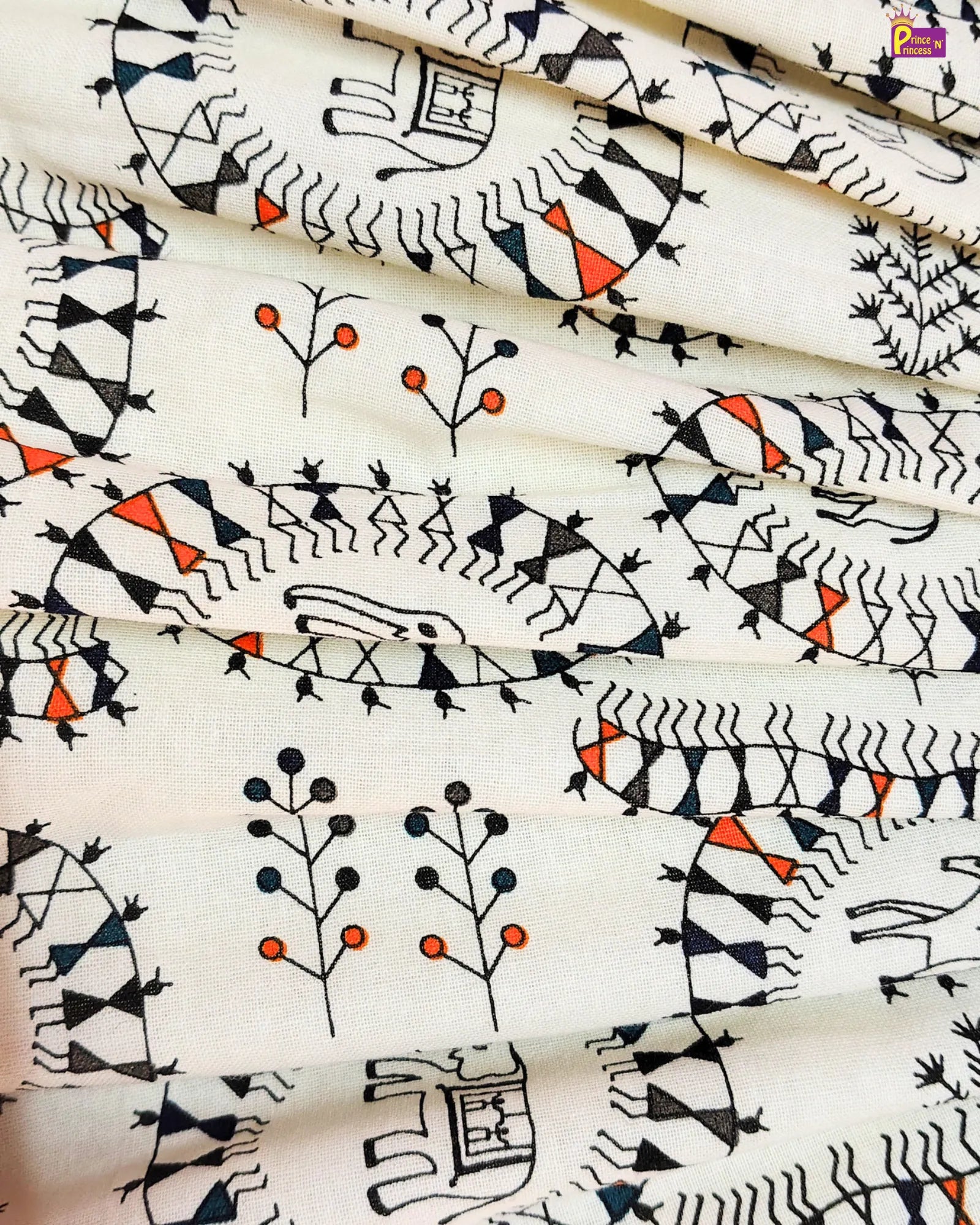 Fabric with black and orange tribal patterns on a white background