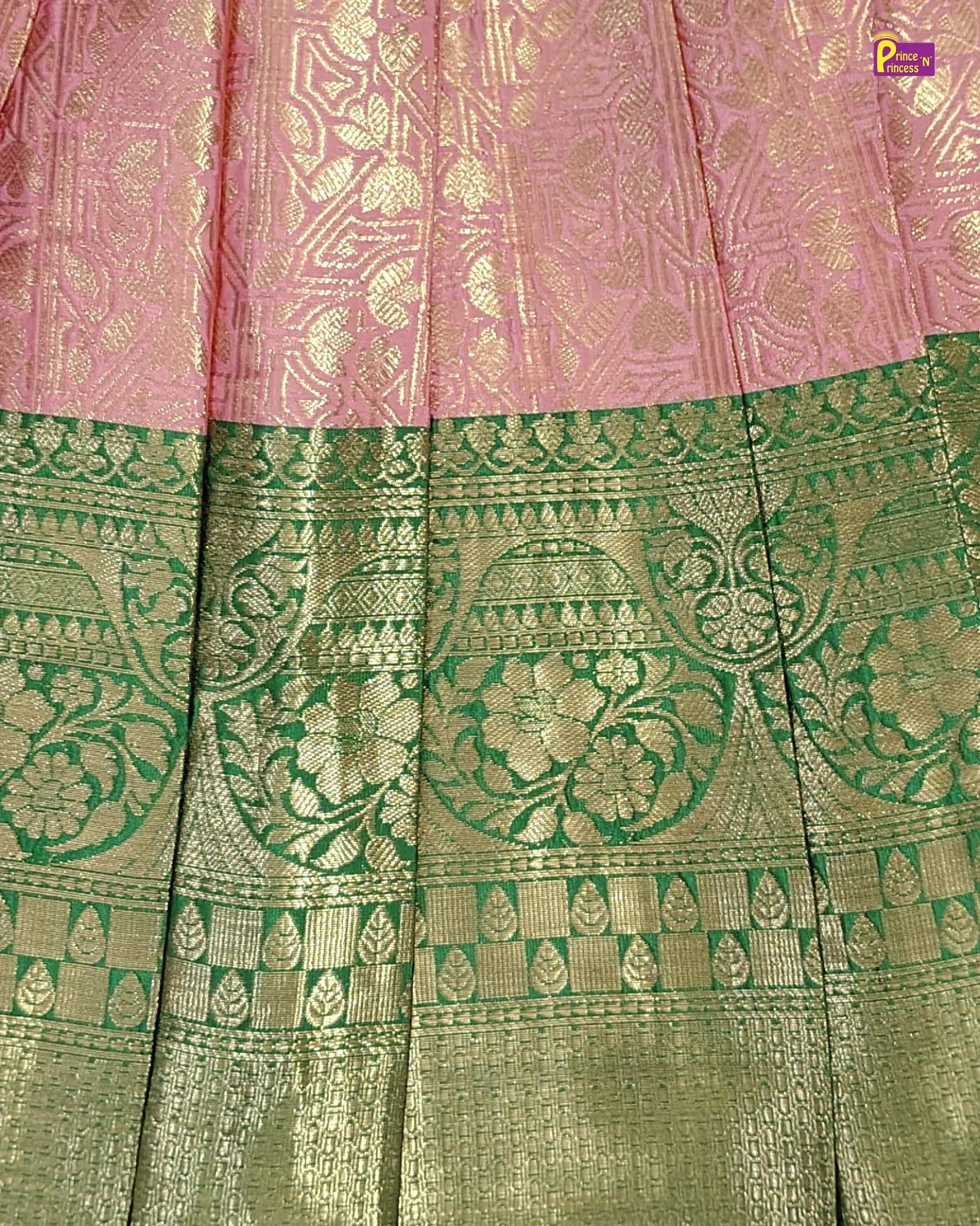 Traditional pink and green fabric with intricate patterns