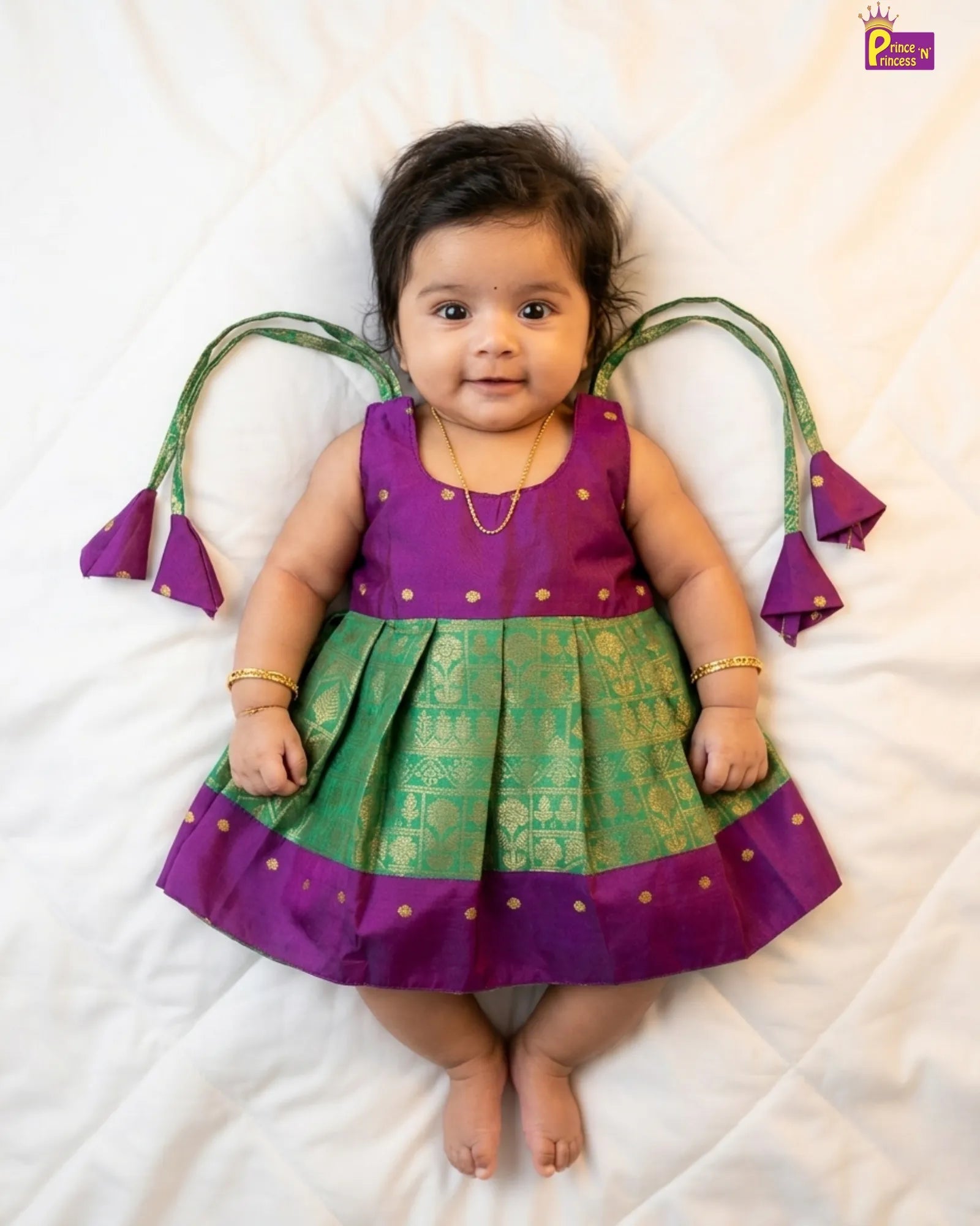 Newborn baby girl in green raw silk pattu frock by Prince N Princess