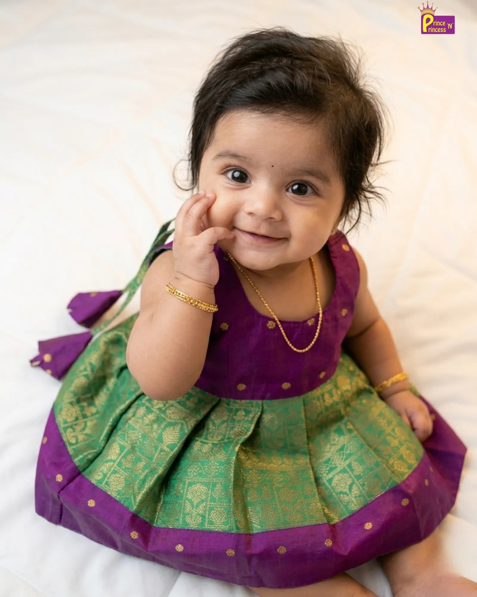 Newborn baby girl in green raw silk pattu frock by Prince N Princess