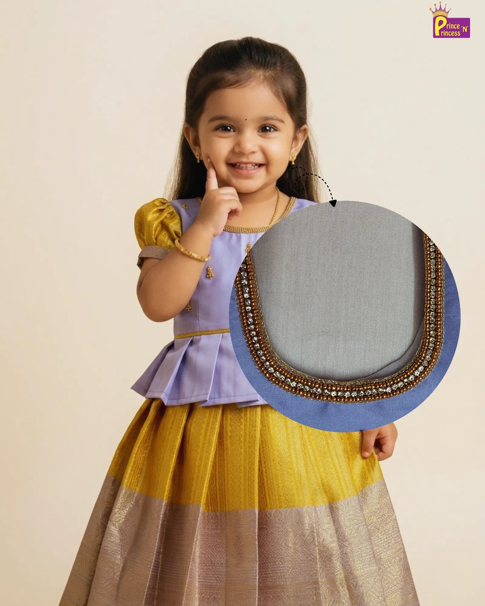 Young girl in a traditional outfit with a close-up of a decorative piece.