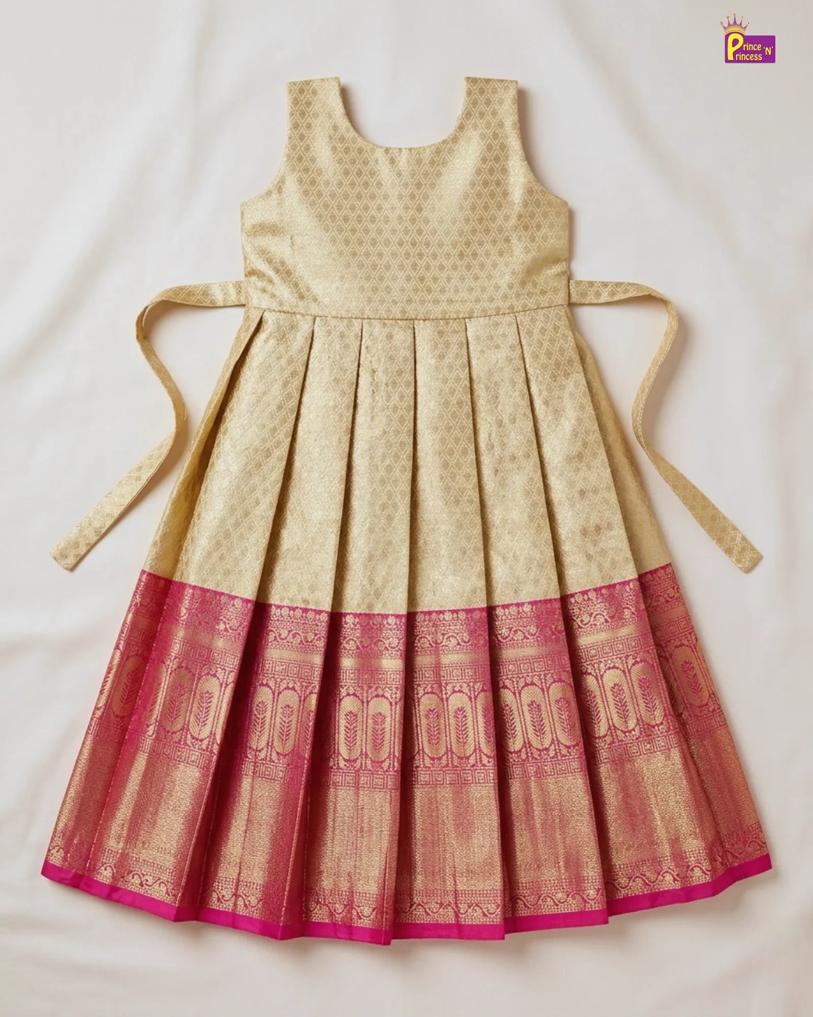 Beige and red patterned dress with tied sleeves on a light background