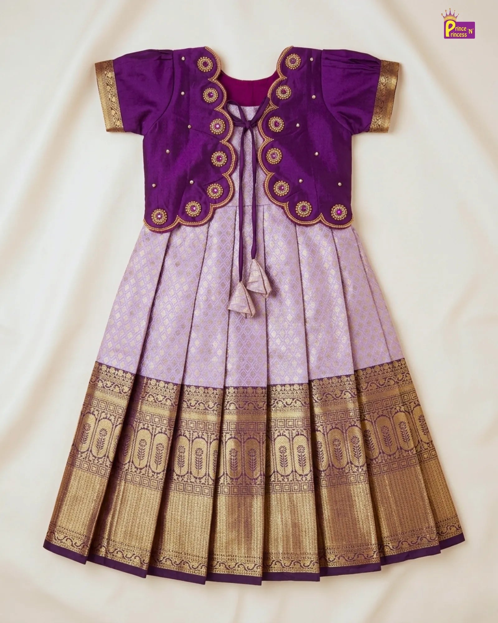 Purple and gold traditional outfit on a white background