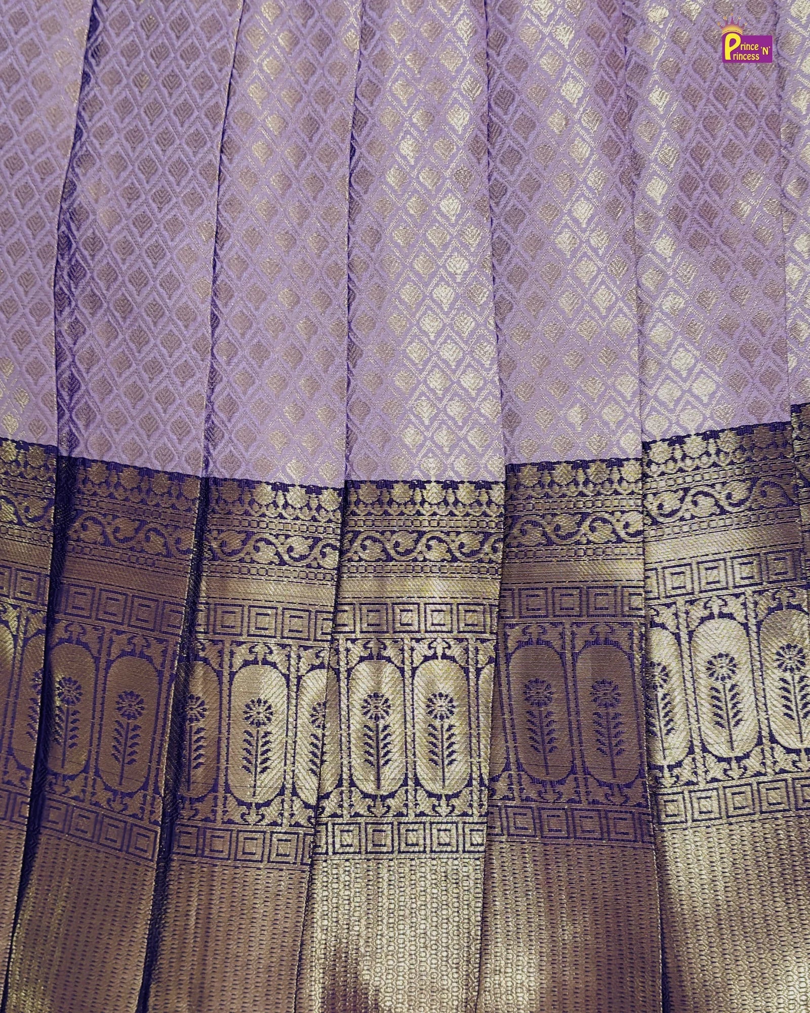 Purple saree with a detailed border pattern on a plain background