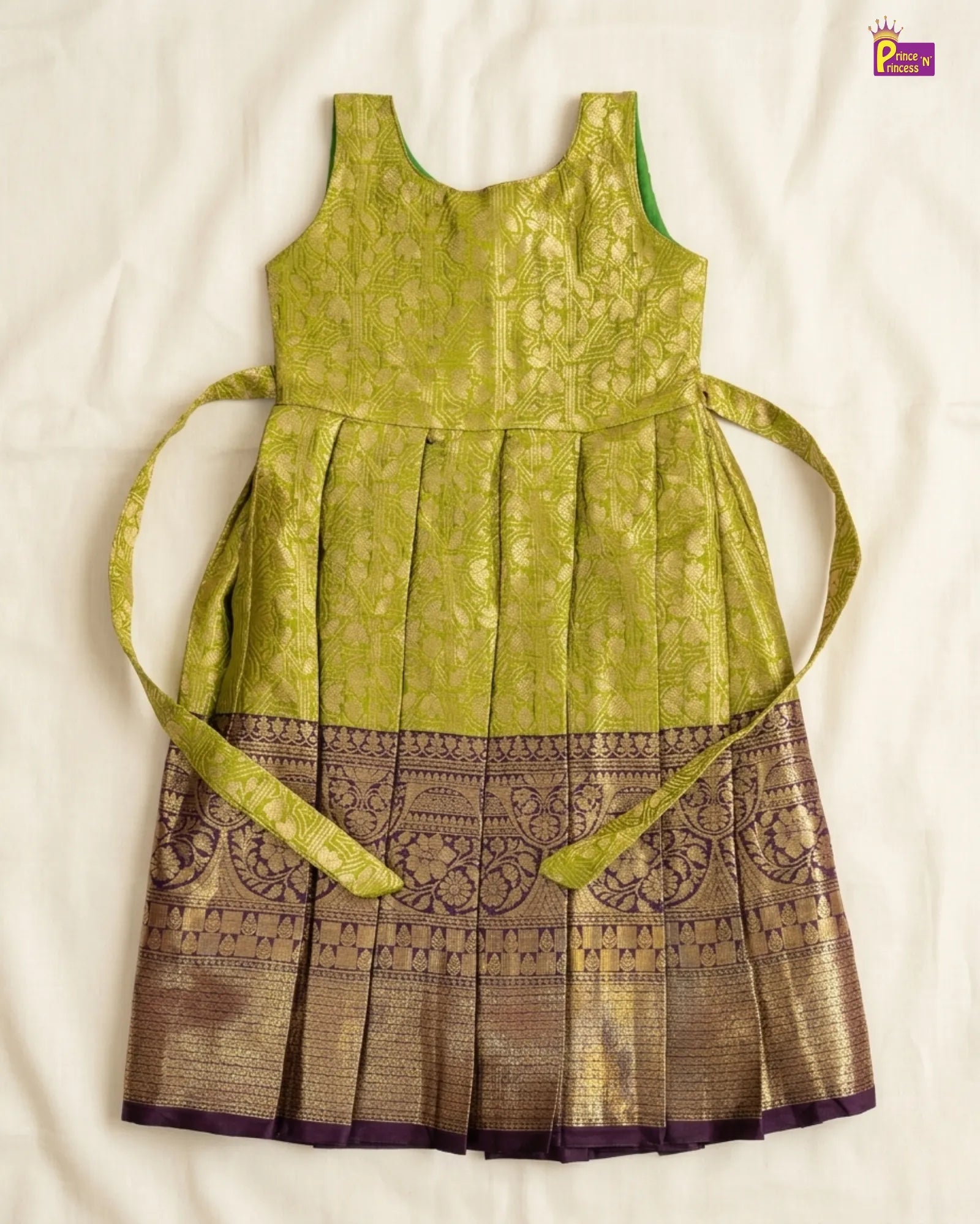 Green and brown dress with a belt on a white background
