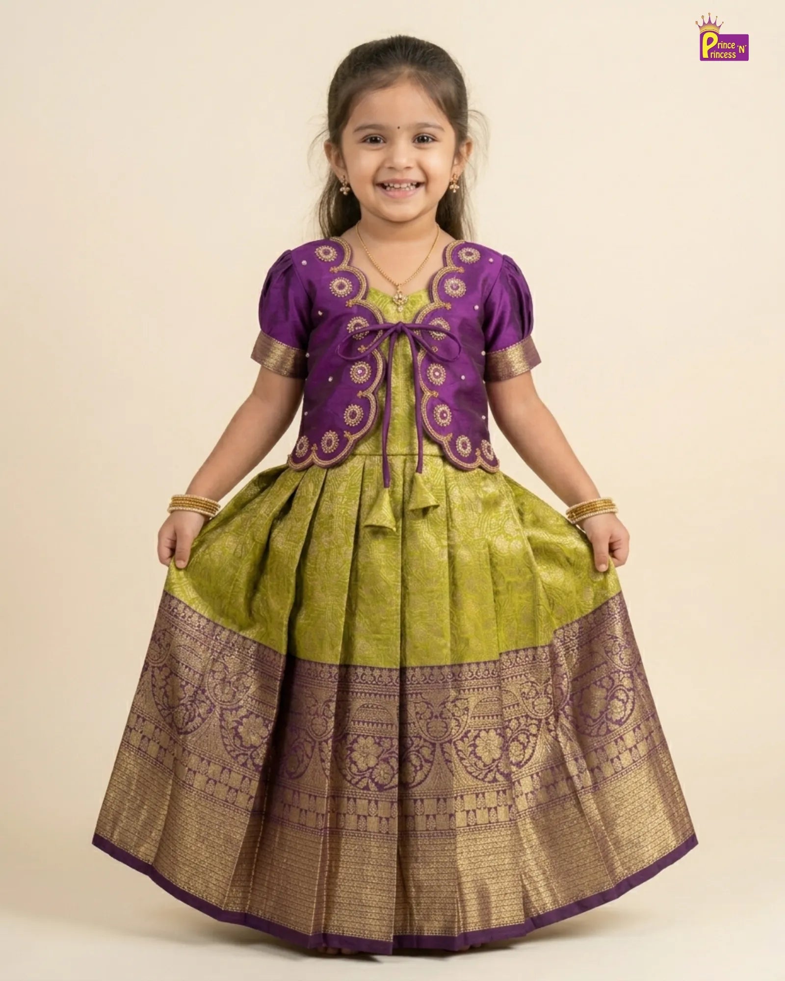 Young girl wearing a traditional outfit with a purple top and green and brown skirt on a beige background