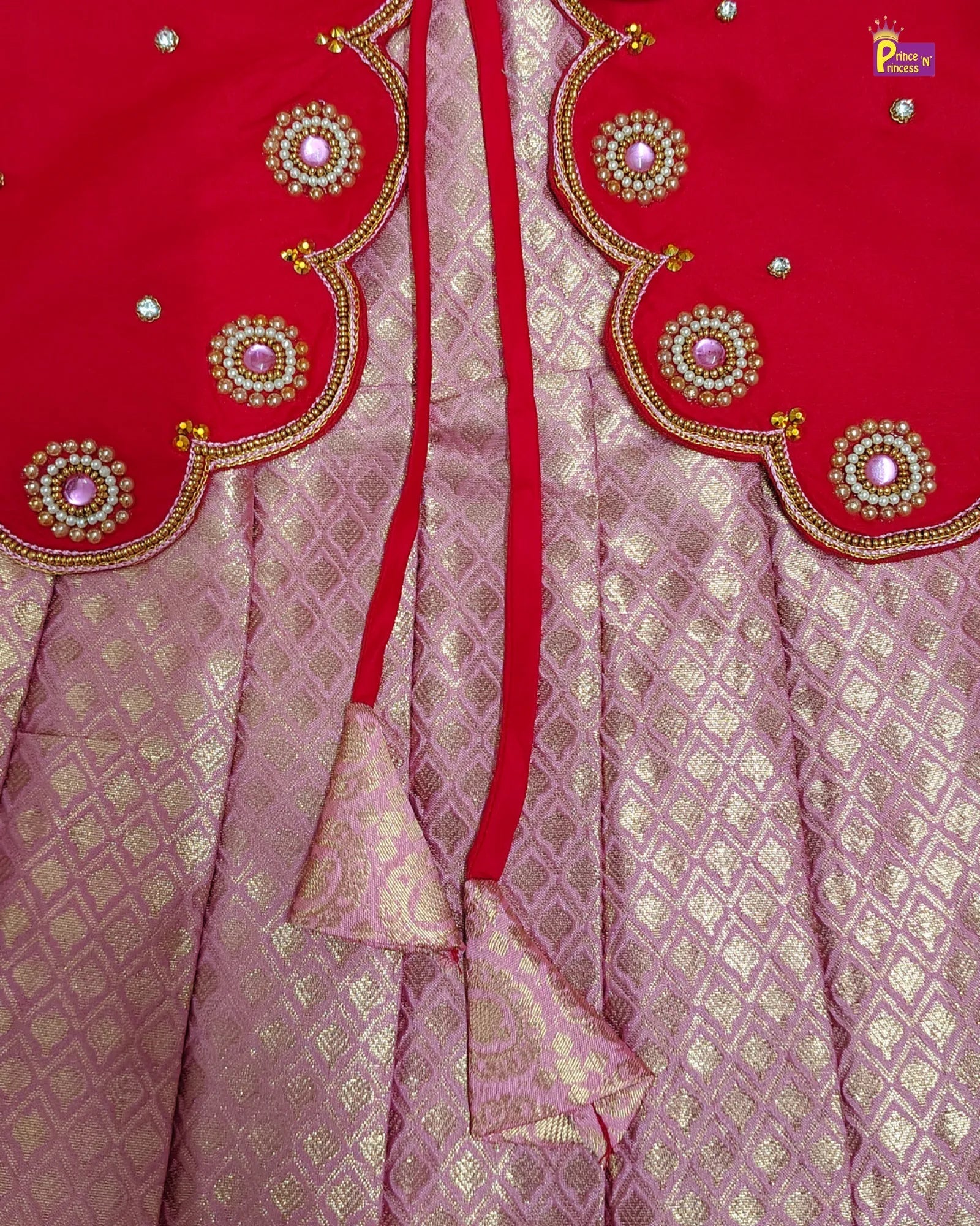 Red and pink saree with intricate gold embroidery