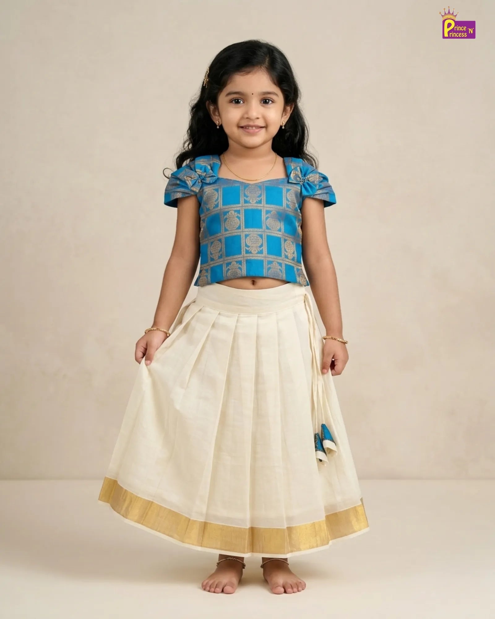 Young girl wearing a blue blouse and white skirt with gold trim on a beige background