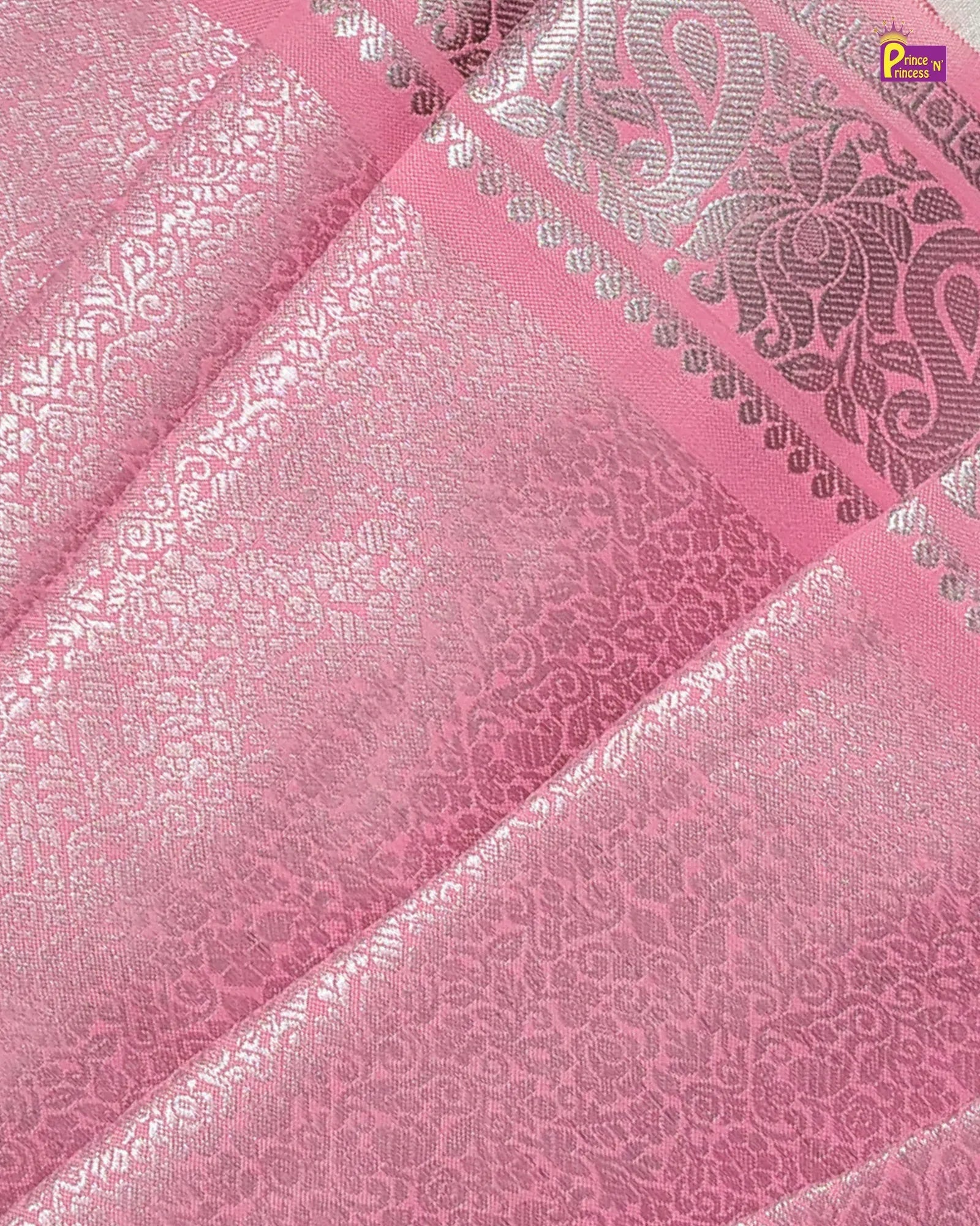 Pink fabric with silver floral patterns