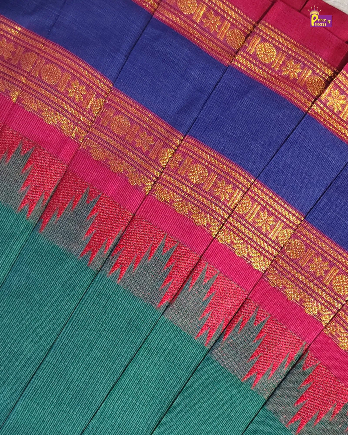 A close-up of a woven textile with broad horizontal bands of deep blue, magenta pink, and teal green, separated by ornate gold zari borders and red chevron-like accents.