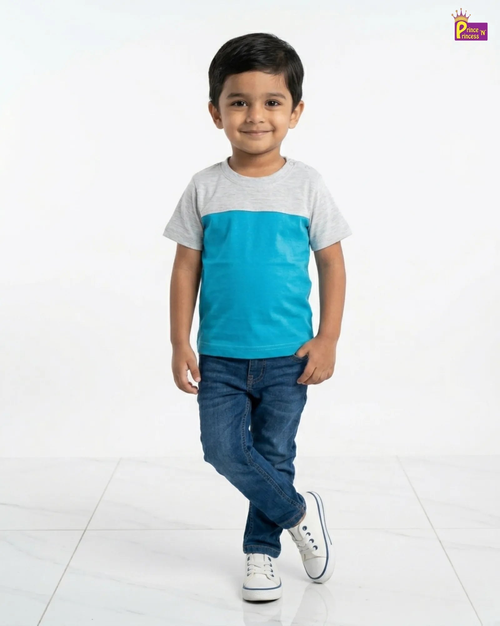 Child wearing a two-tone shirt with a blue and gray design on a white background