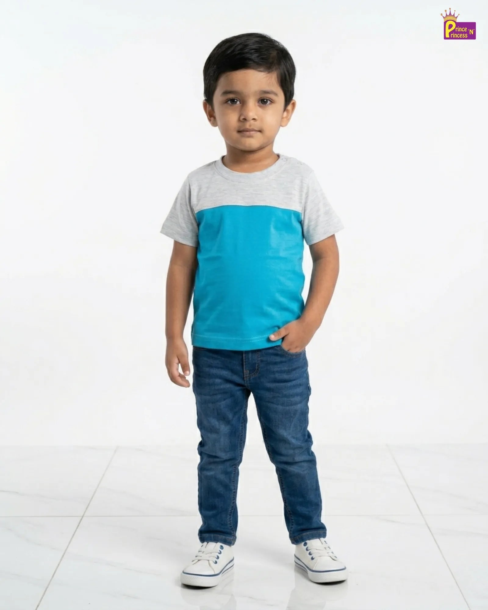 Child wearing a two-tone shirt and jeans on a white background