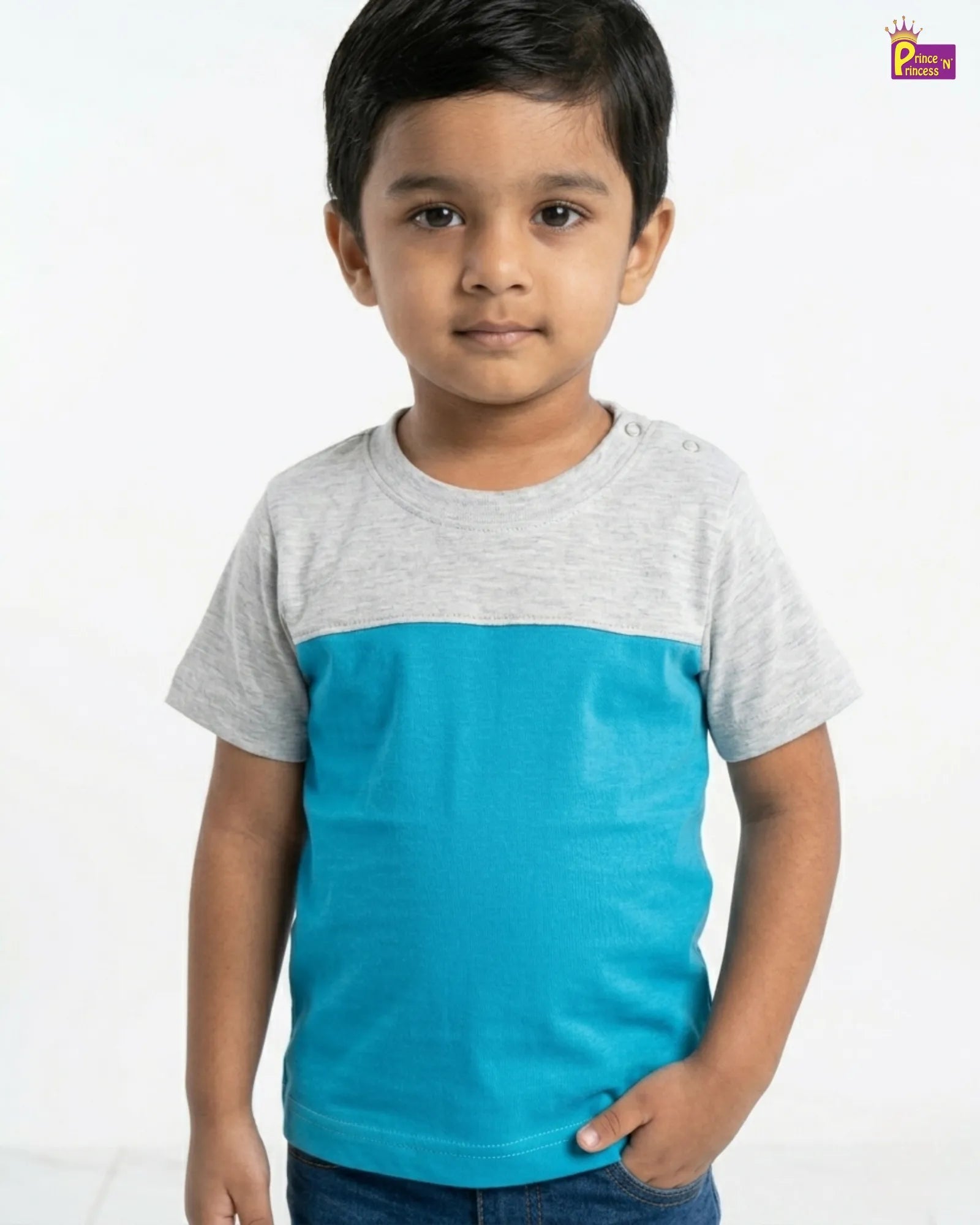 Child wearing a gray and blue t-shirt on a white background