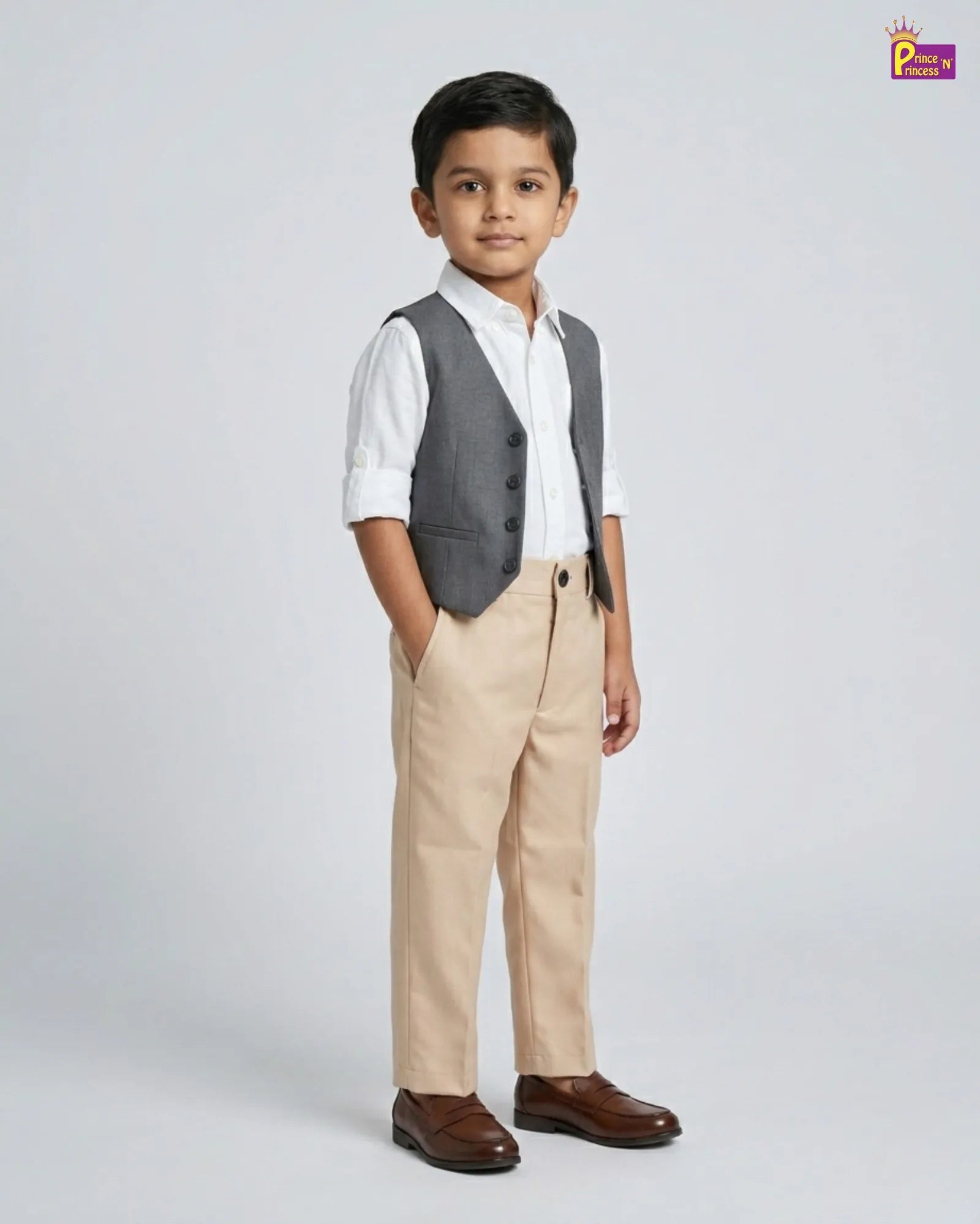 Young boy wearing a formal outfit with a vest, shirt, pants, and shoes on a white background.