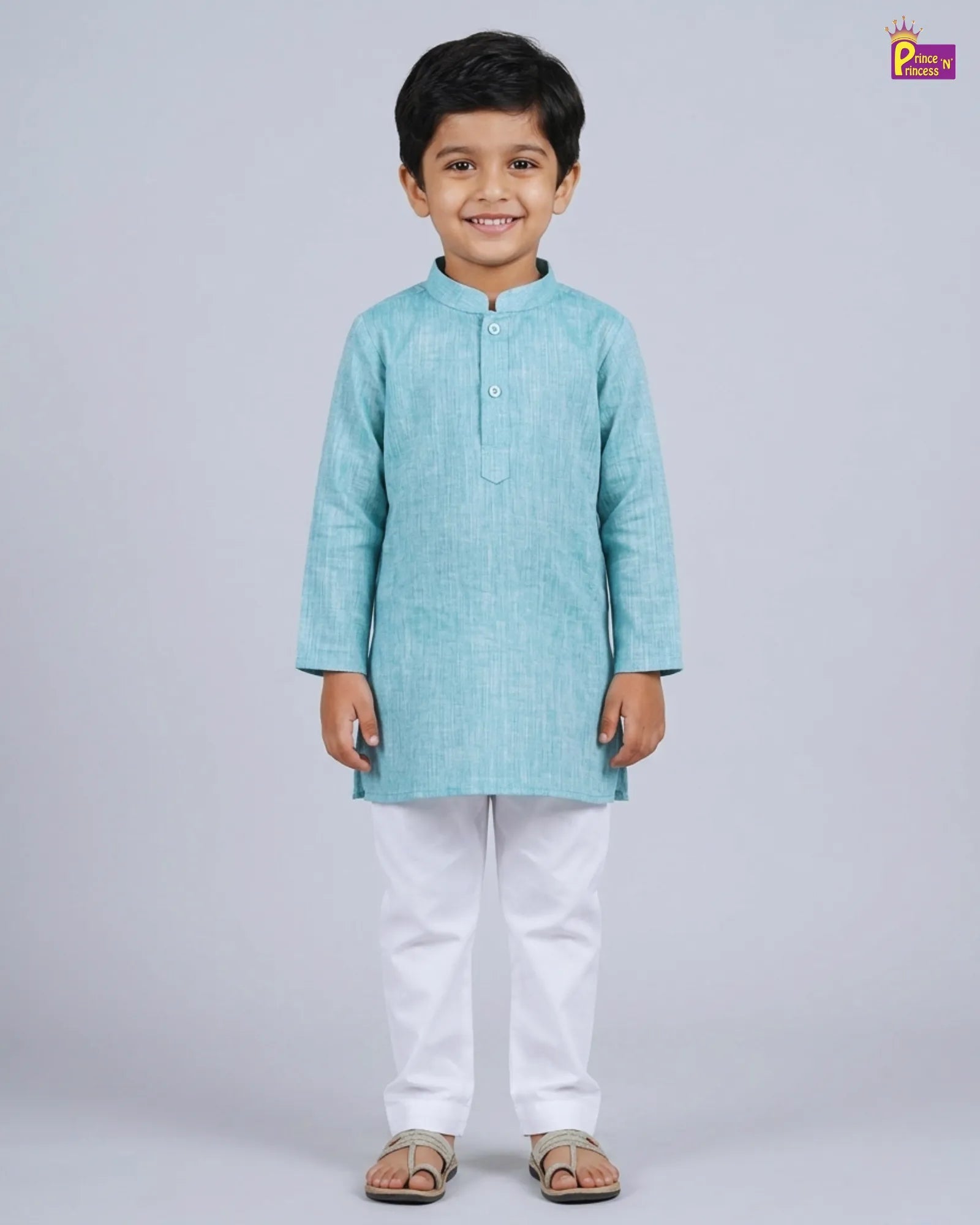 Boy in teal blue plain slub cotton kurta and white pajama ethnic set from Prince N Princess boys kurta collection