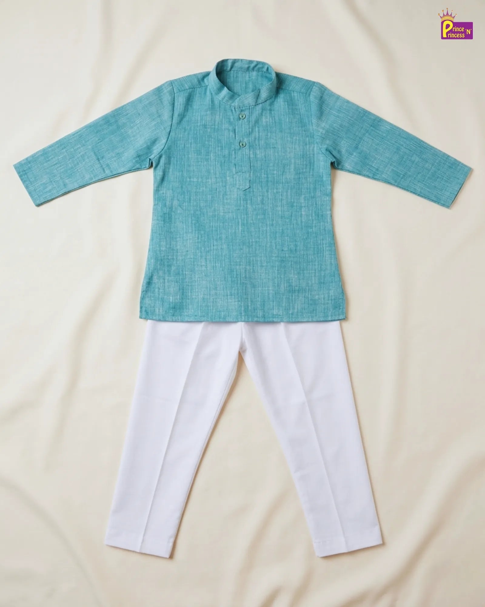 Teal kurta with white pants on a beige background