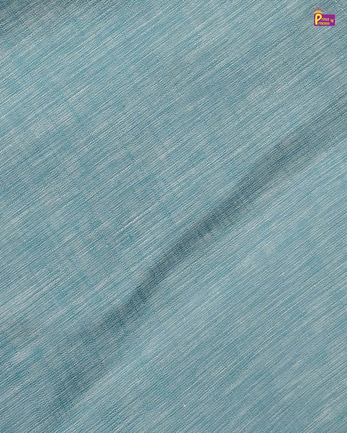 A close-up of a light blue fabric with a subtle diagonal slub texture and a soft sheen, featuring a small brand logo in the top right corner.