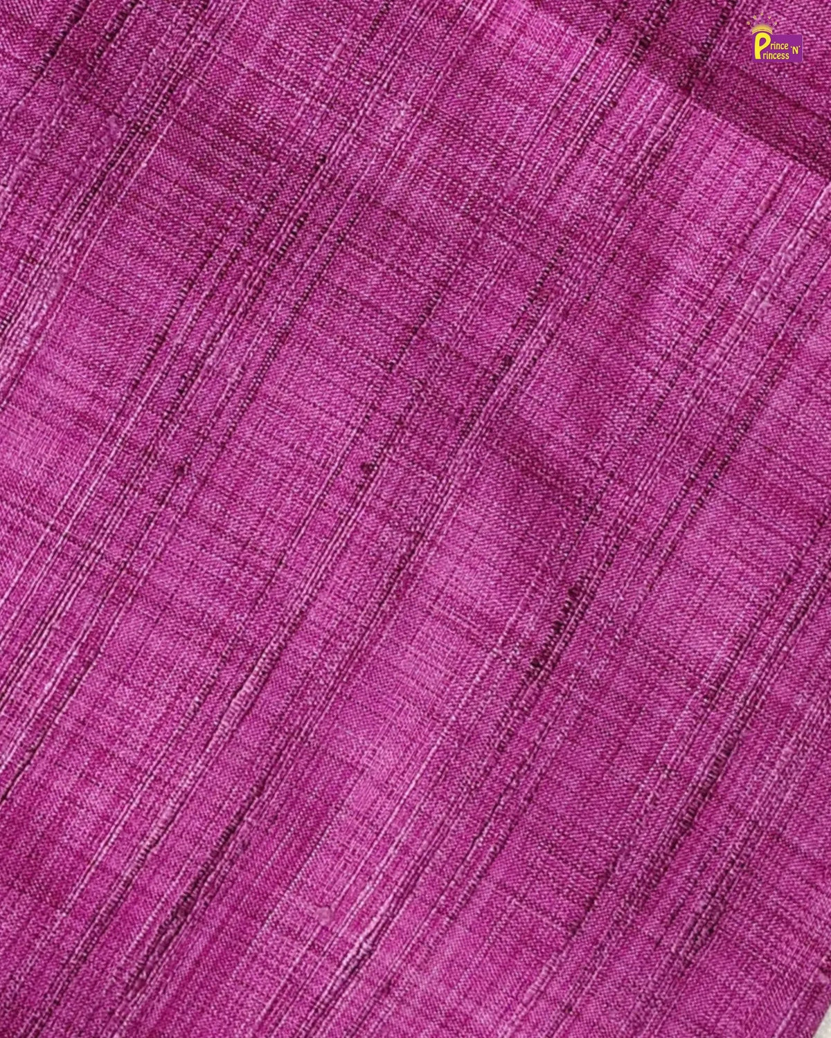 A close-up of a textured magenta purple woven fabric with a subtle diagonal twill pattern.