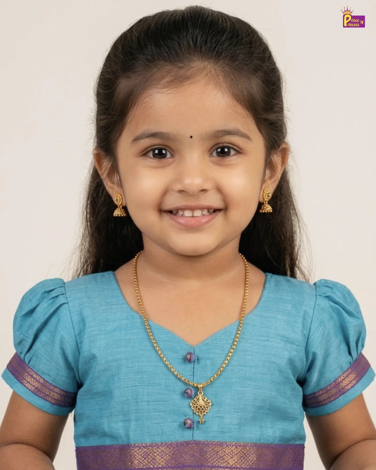 Young girl wearing a blue and purple traditional dress on a white background