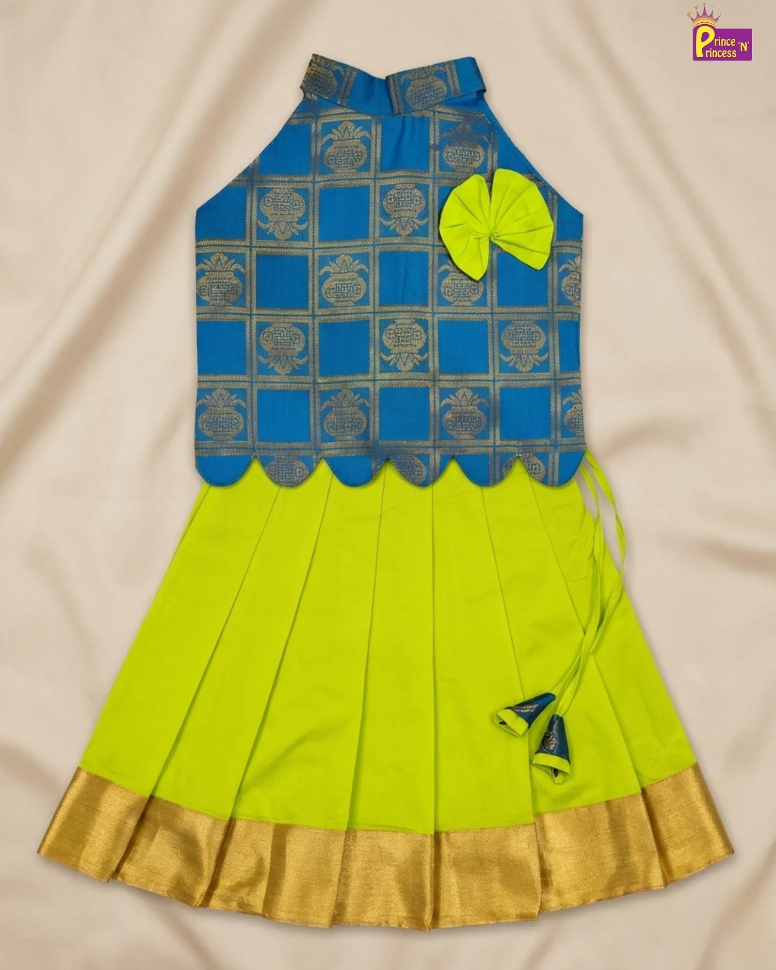 Blue and green traditional outfit with a bow on a beige background