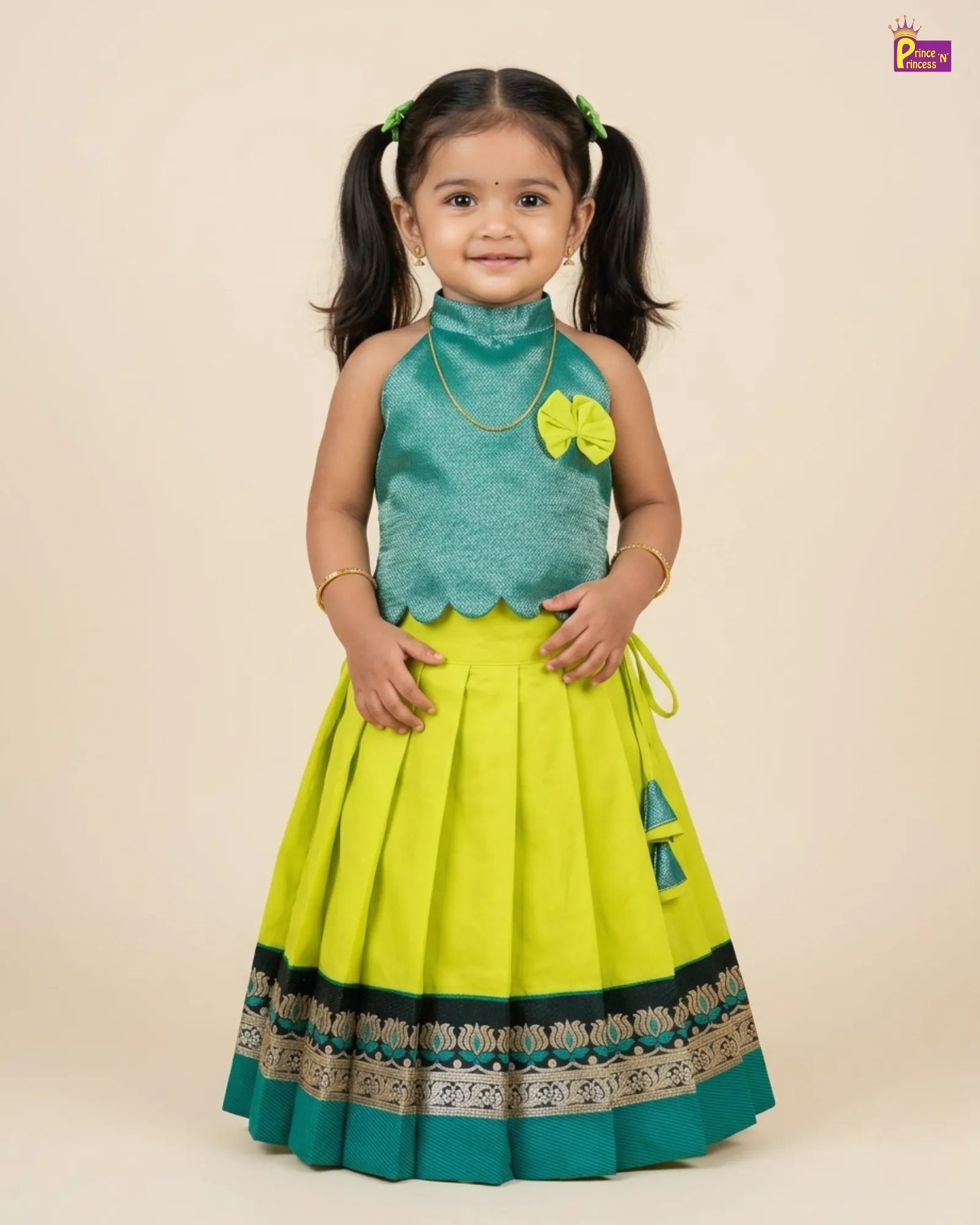 Young girl wearing a green and yellow traditional outfit with floral details on a beige background