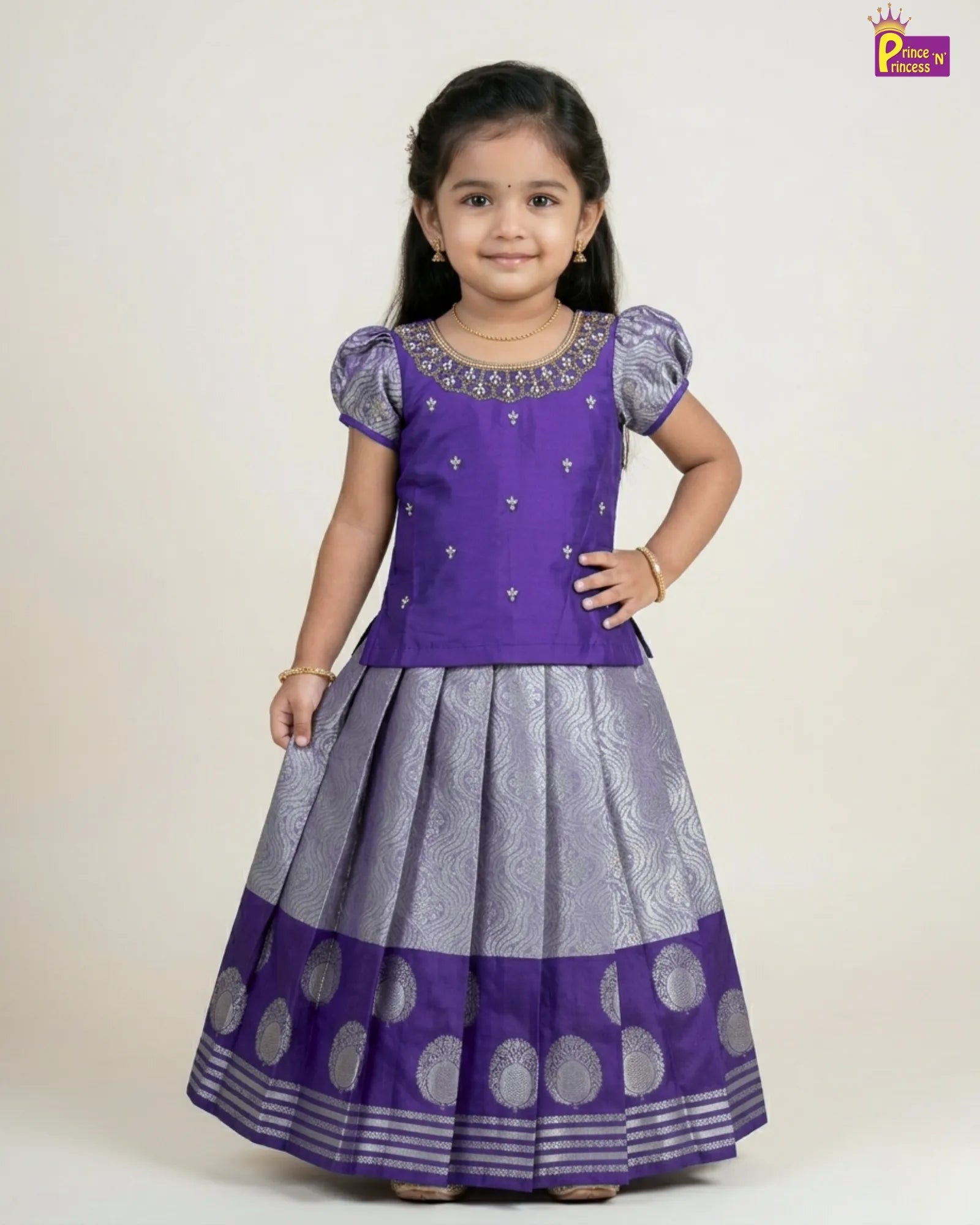 Young girl wearing a purple and gray traditional outfit on a white background