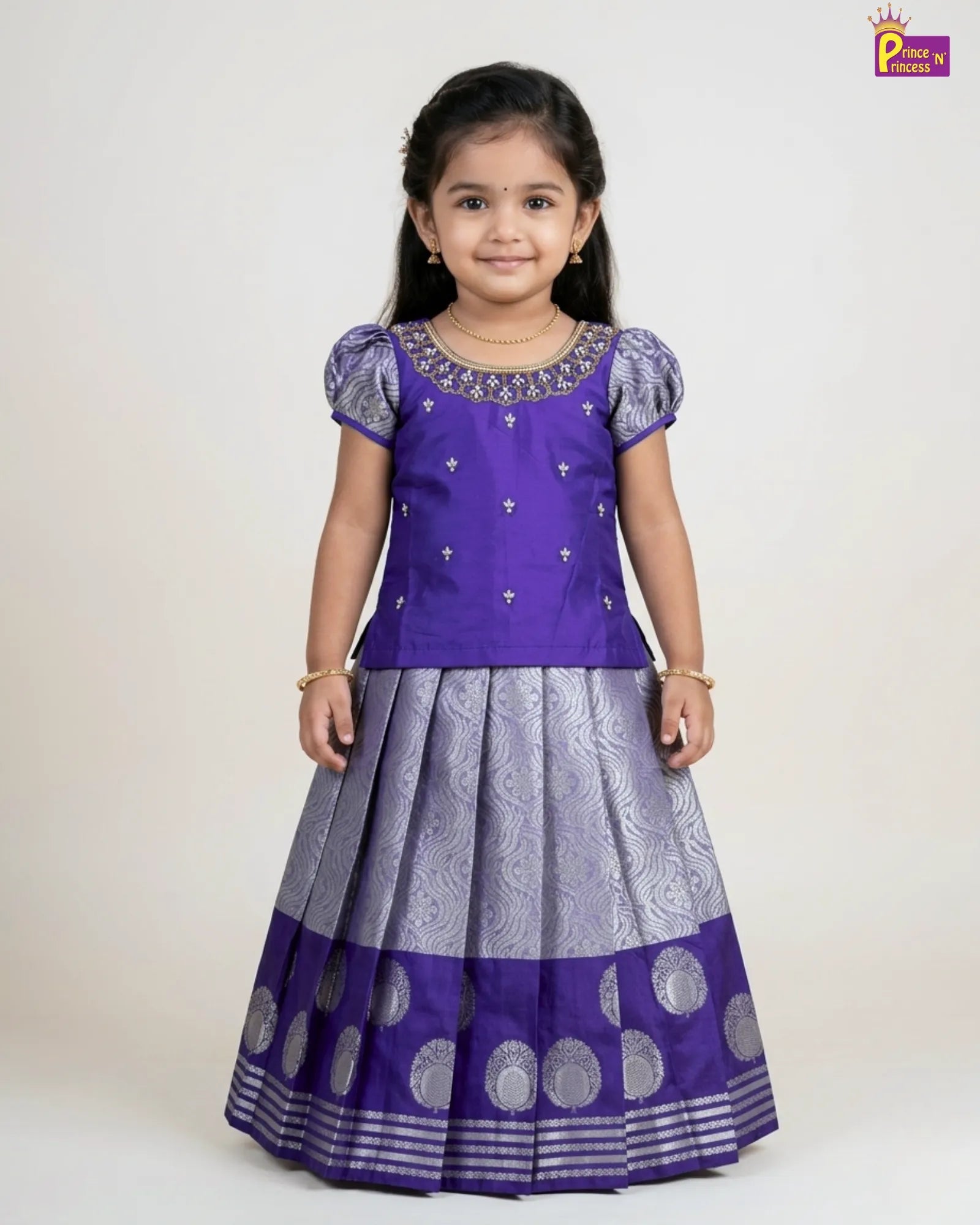 Young girl wearing a purple and gray traditional outfit on a white background